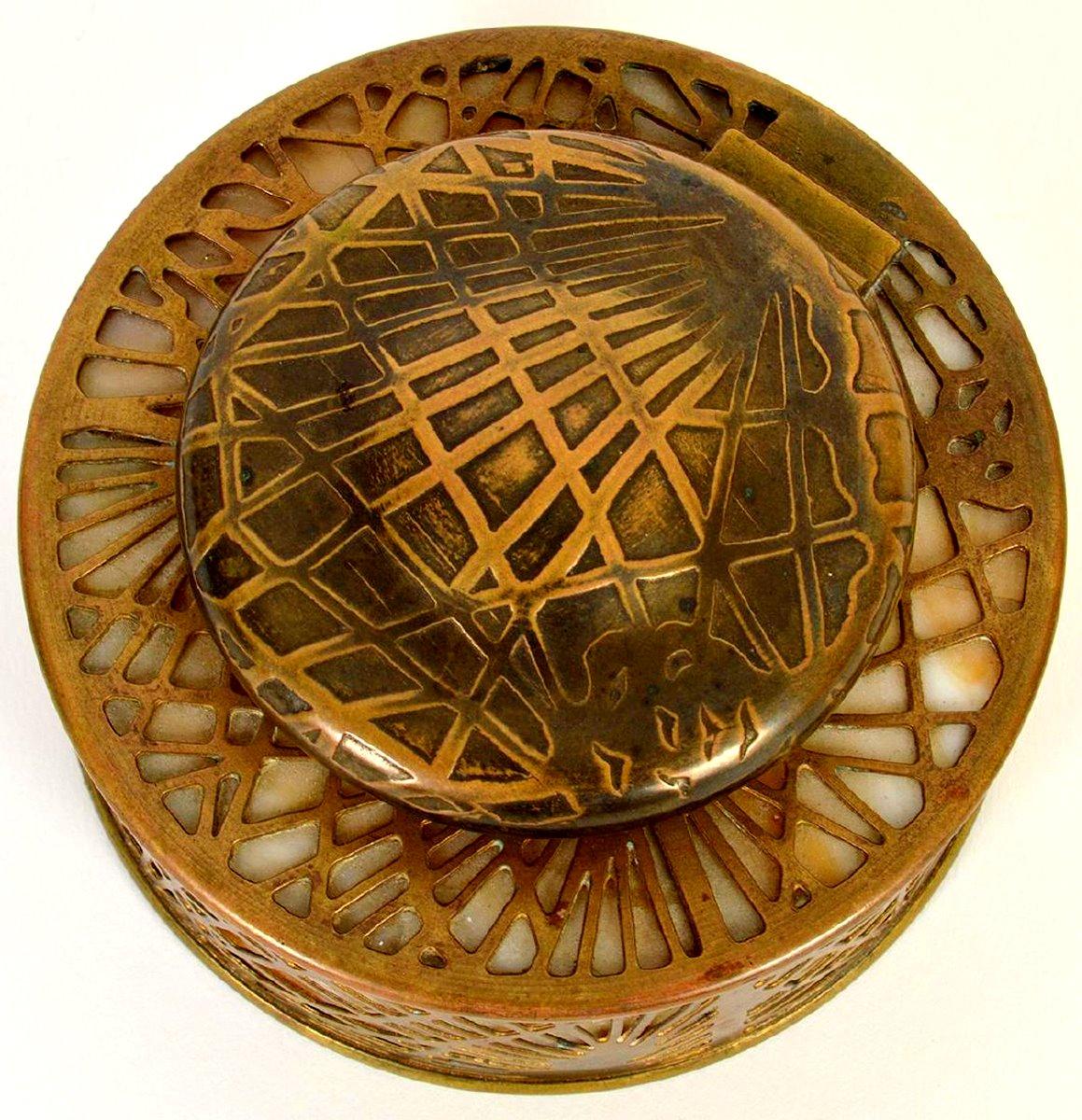 Bronze pine needles laid over amber slag glass make this inkwell in Tiffany Studios' most popular pattern exquisite.

A few important notes about all items available through this 1stdibs dealer:

1. We list all our items as being in 
