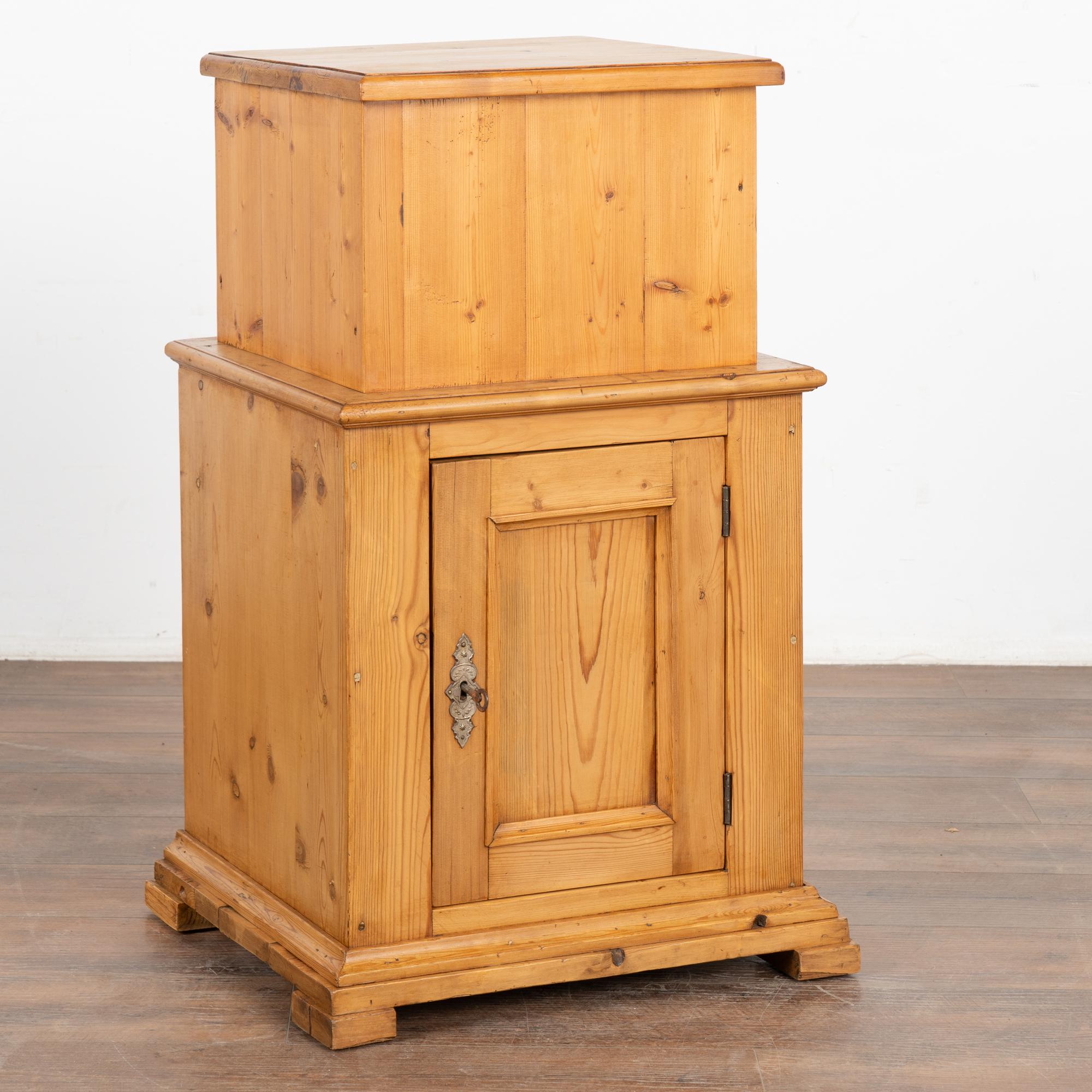 Antique pine nightstand or small cabinet resting on simple block feet.
Note the natural wax finish that brings out the warmth of the pine. Storage is in the lower section only. The upper section (no storage access) raises it to 34.5