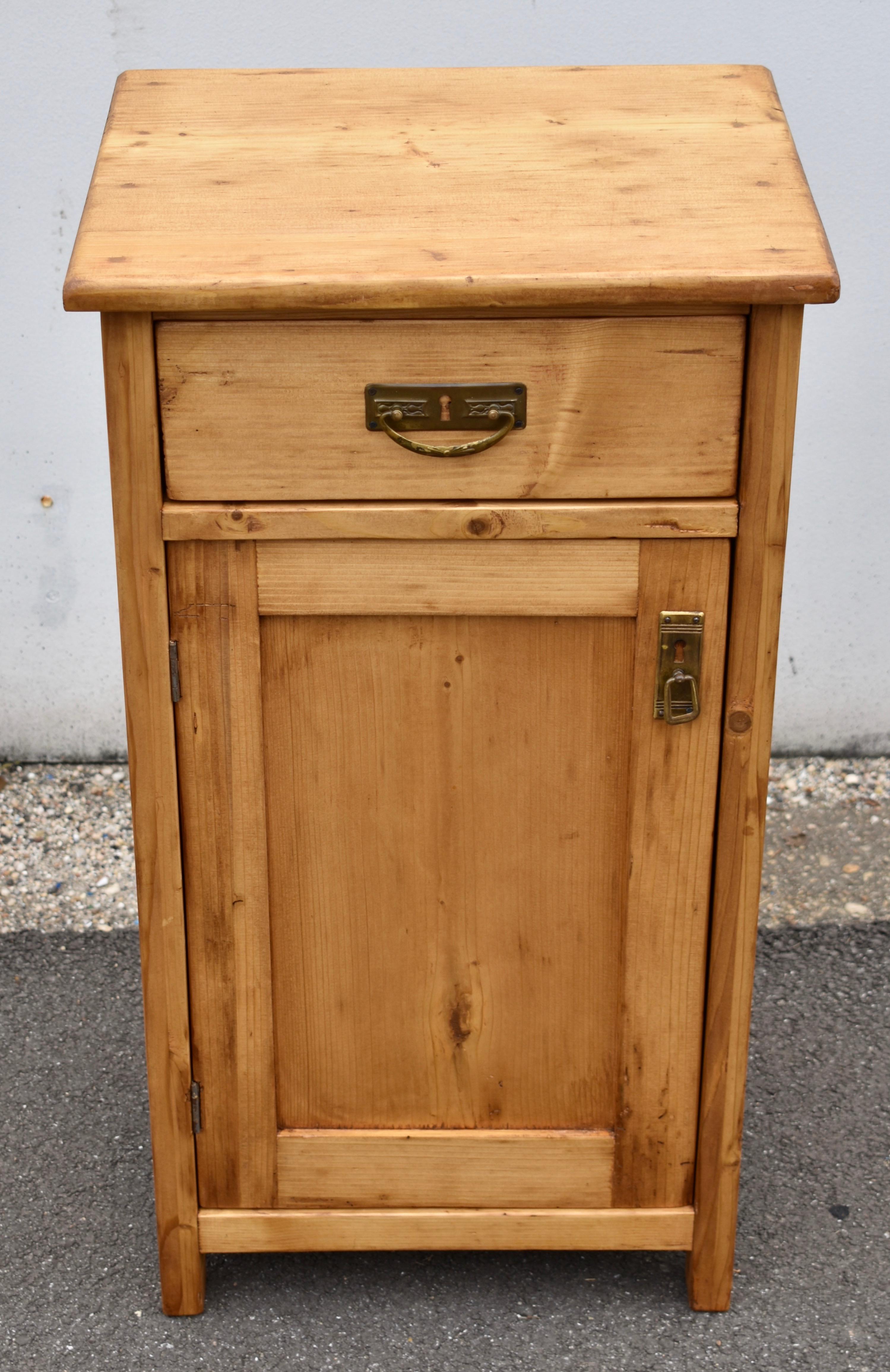 This handsome nightstand has great lines and a lovely color.  It features a flat paneled door and a hand-cut dovetailed drawer.  There is a single shelf in the interior.  Useful for storage in the office or guest room.
   
