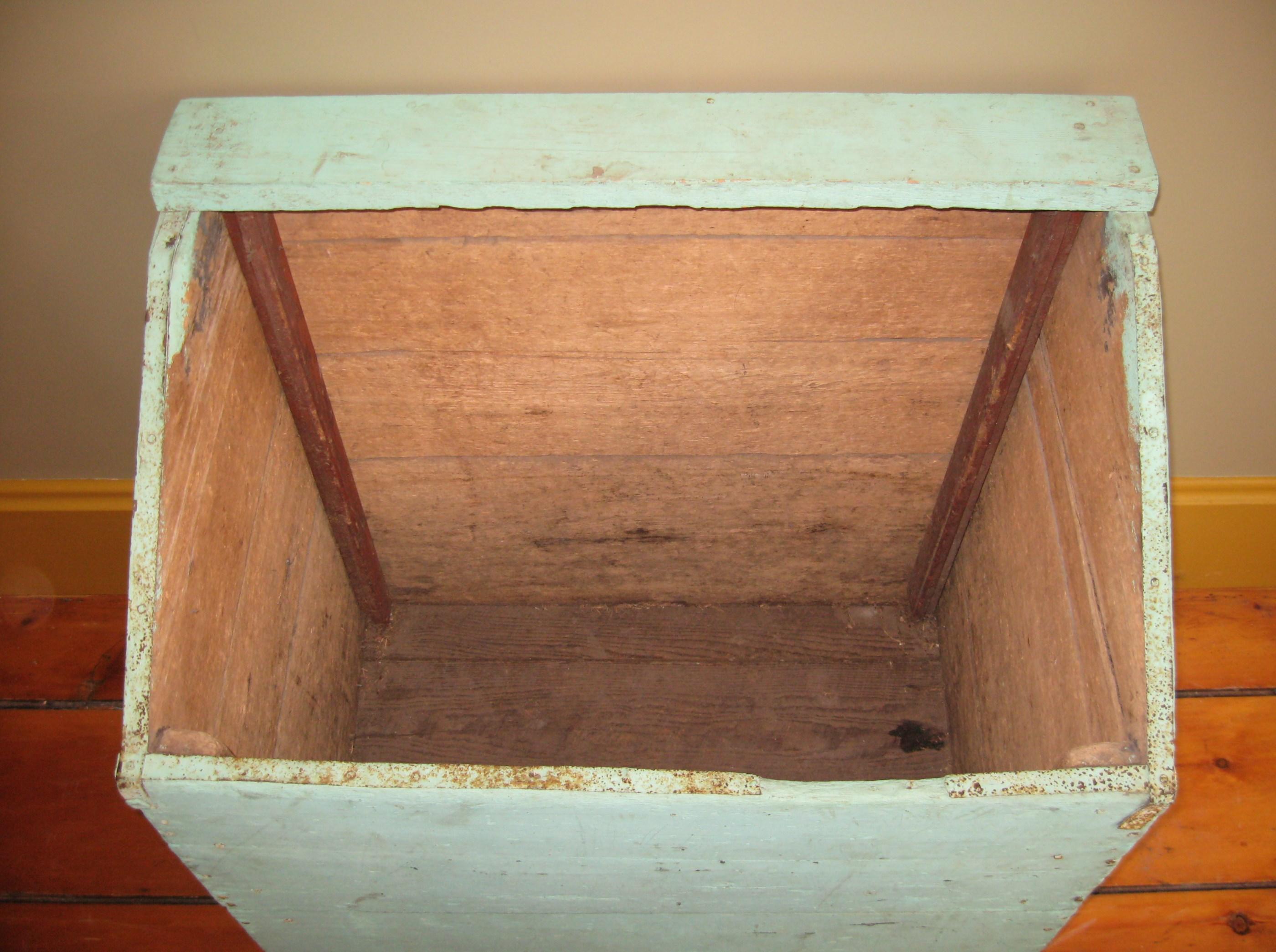 This is an early pine wooden box. Great for storing firewood. We used it as a recycling bin. Multi-functions with this great early pine box. Wonderful light green coloring on this! You don't find these anymore! A true antique piece that came out of