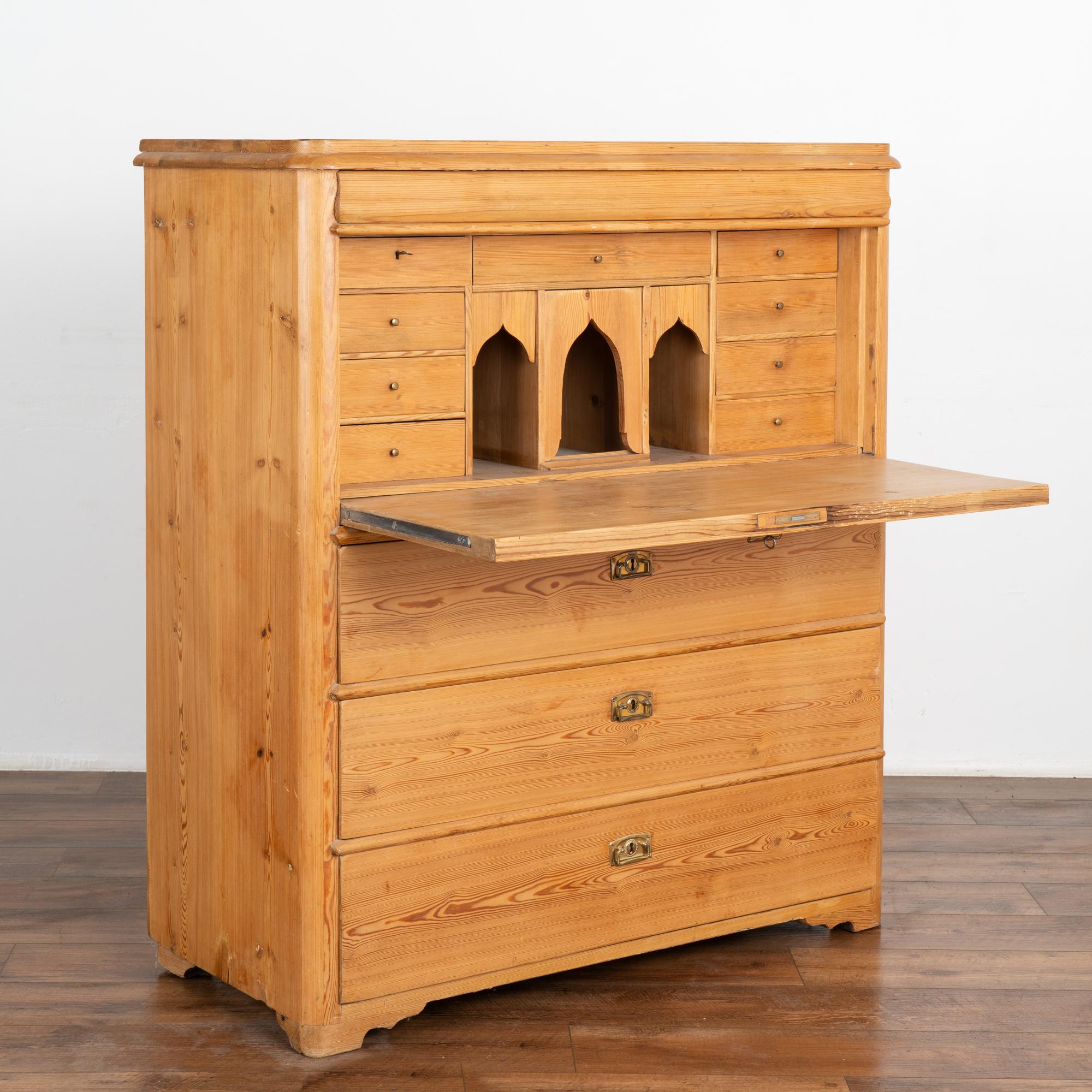 This drop front secretary is charming in every way, with a soft, satin wax finish that compliments the warm patina of the pine and Swedish country styling.
The interior drawers and cubbies create an inviting interior work space. Three functioning