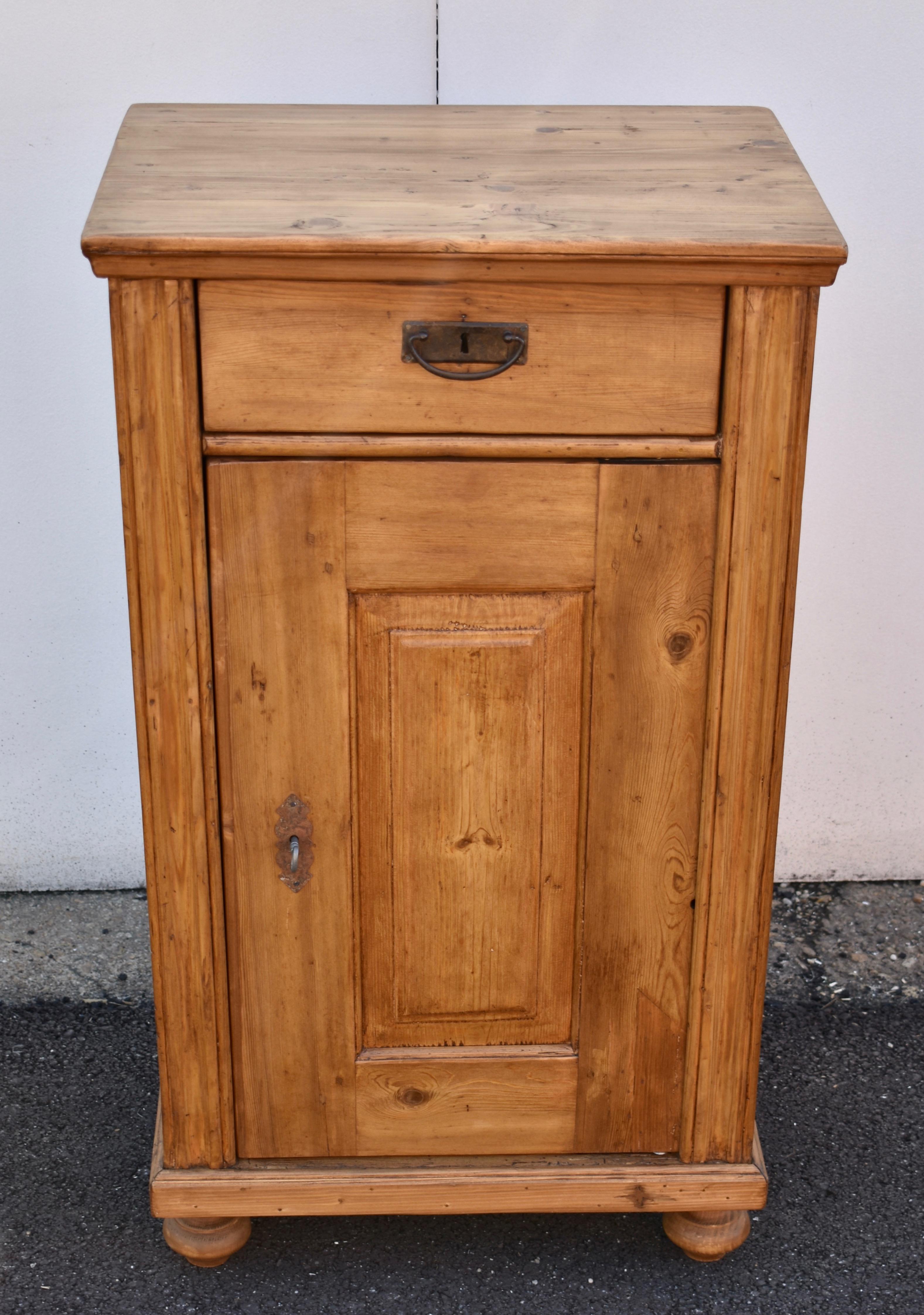 This is a truly lovely side cupboard. It has great color, very clear wood, and stands beautifully. From its two tier crown, its hand-cut dovetailed drawer and the wide fluting on the front cormners, to the broad rails and stiles of the door frame