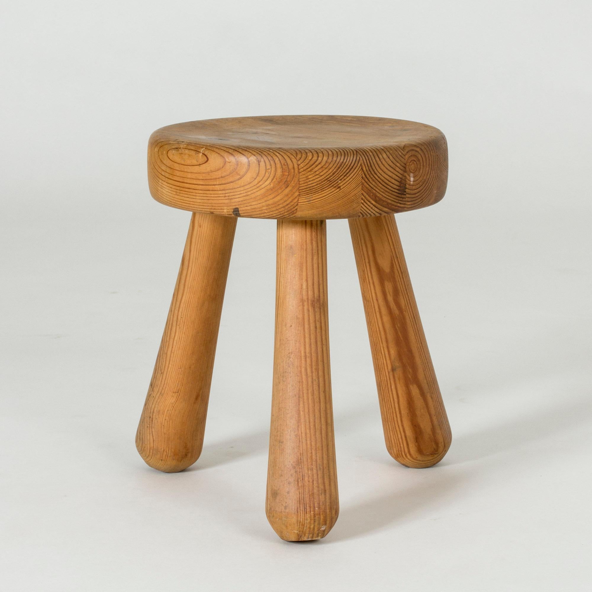 Chunky wooden stool by Ingvar Hildingsson, made from pine with beautiful wood grain. Three legs and round seat, designed in a clean, appealing form.