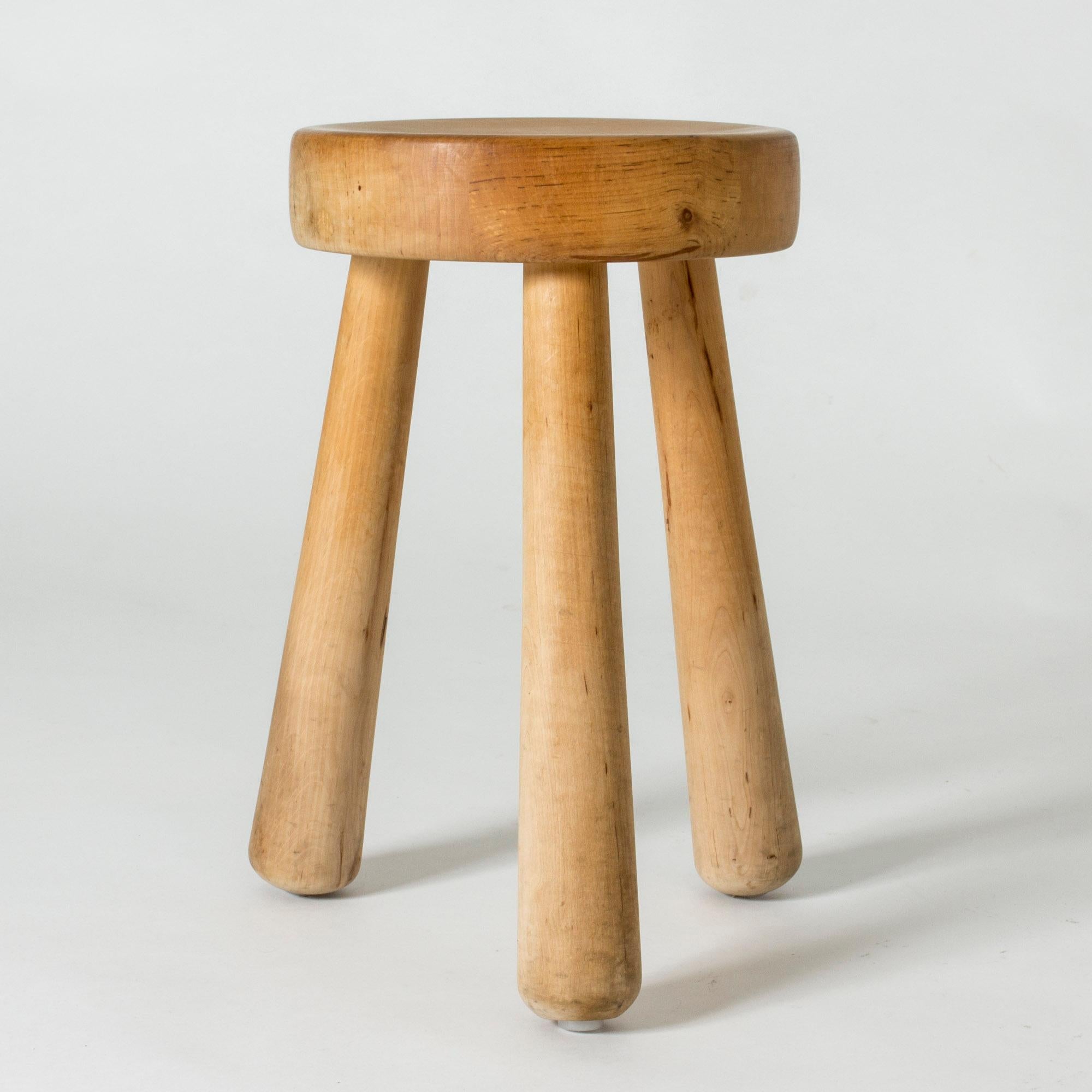 Chunky wooden stool by Ingvar Hildingsson, made from solid birch. Three elongated legs and round seat, designed in a clean, appealing shape.