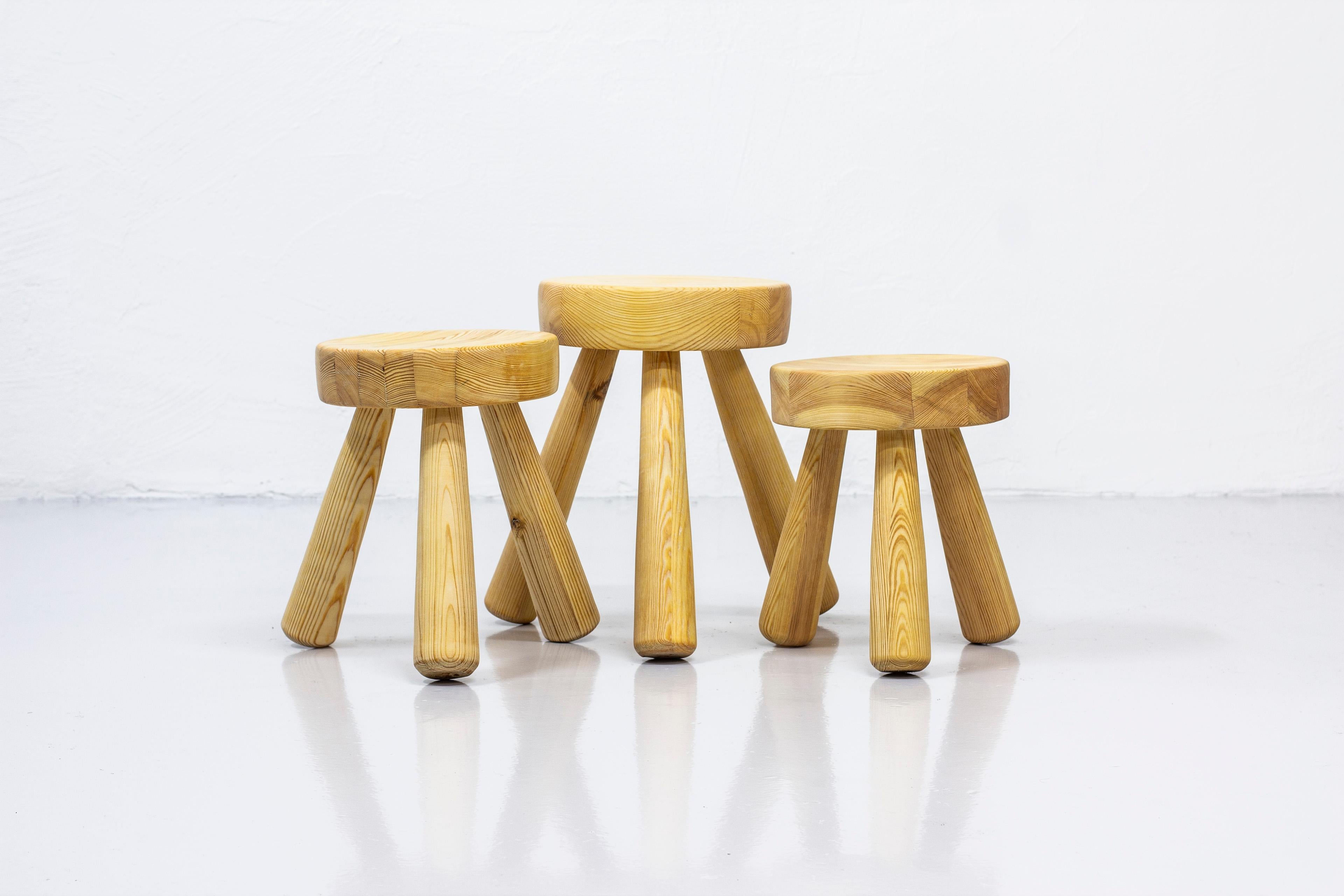 Stools designed and made by Ingvar Hildingsson. Made from hand turned solid pine wood. Very good condition with few signs of age related wear and patina. Three different sizes.

Dimensions: Ø. 26/27/29 W. ca 36/40/42 (in between the legs) H.