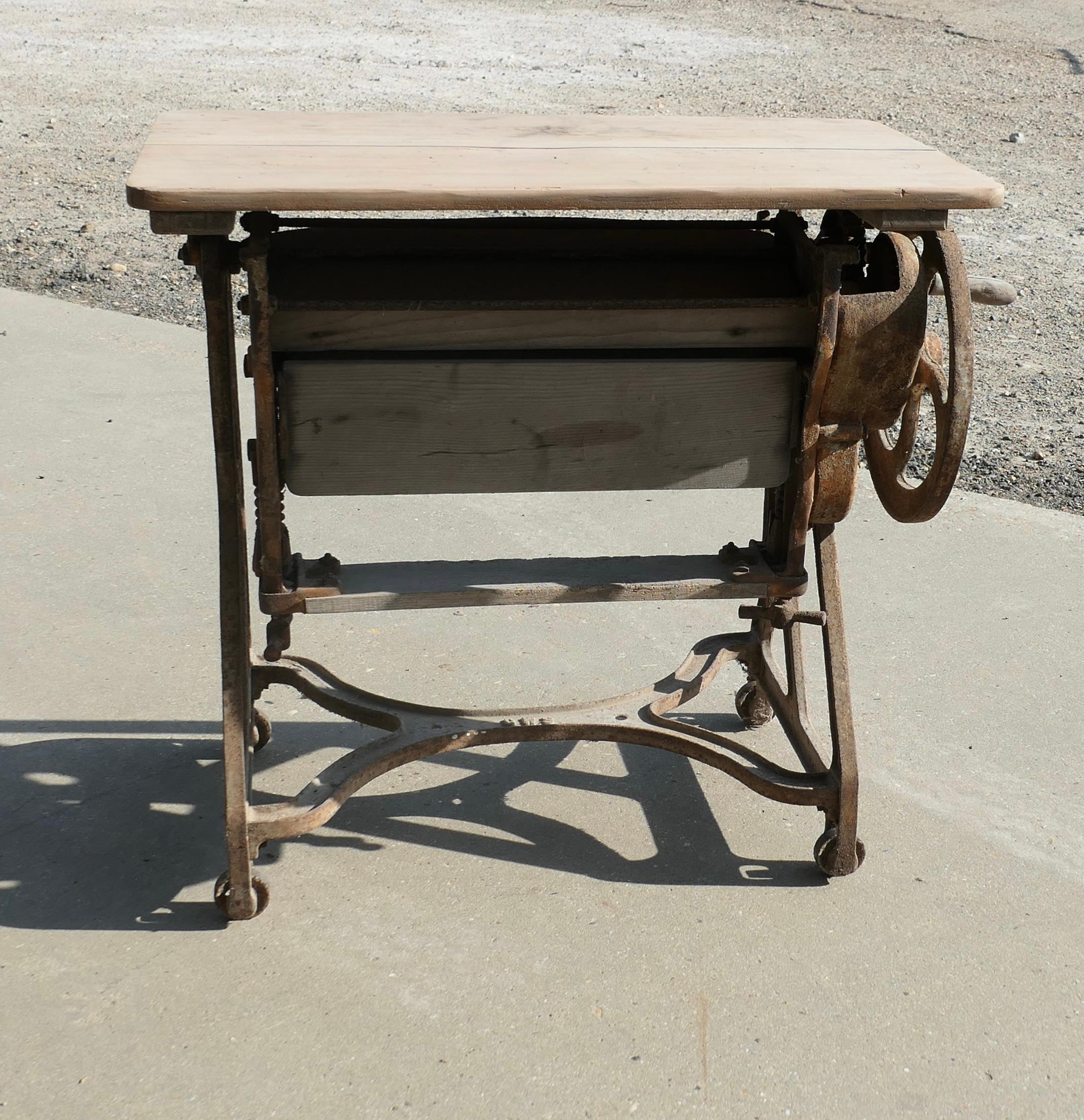 Pine Top Mangle or Cast-Iron Industrial Garden Table

A Great piece of History and a decorative garden Table all in one, you don’t need me to explain how this works, it stands on little wheels so it can be moved if necessary. The Iron Work is in its