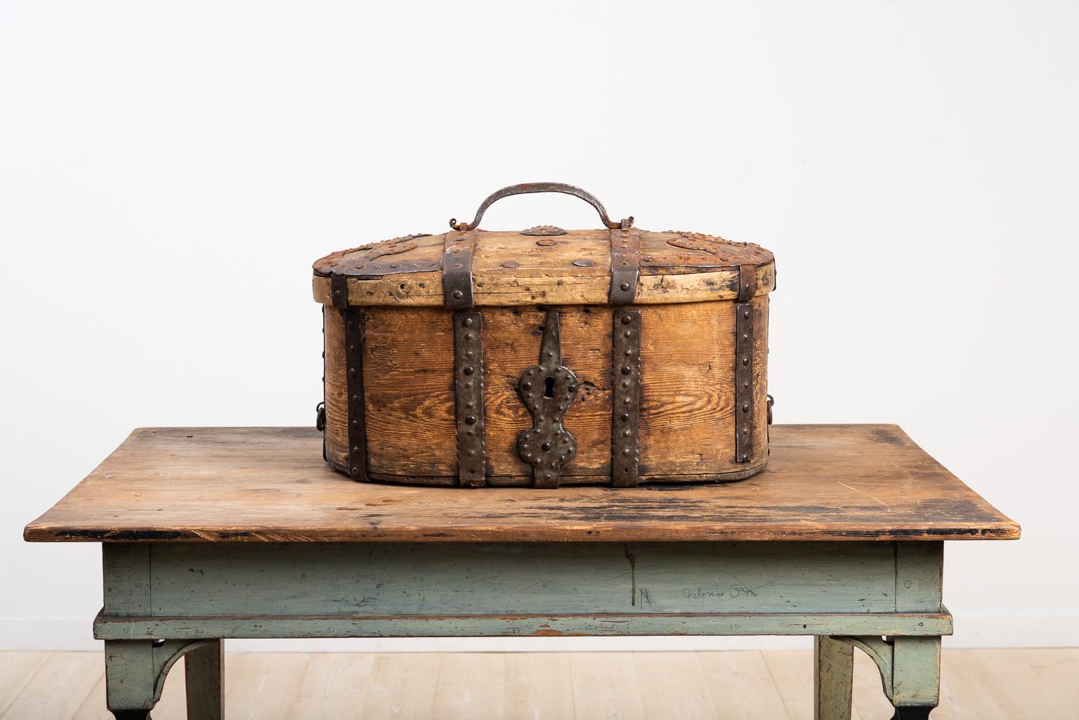 Swedish 18th century wooden travel box manufactured from pine. The box has decorative as well as functional enforcements in handwrought iron. The condition is original and the great patina adds to the look. The box was manufactured in Sweden during