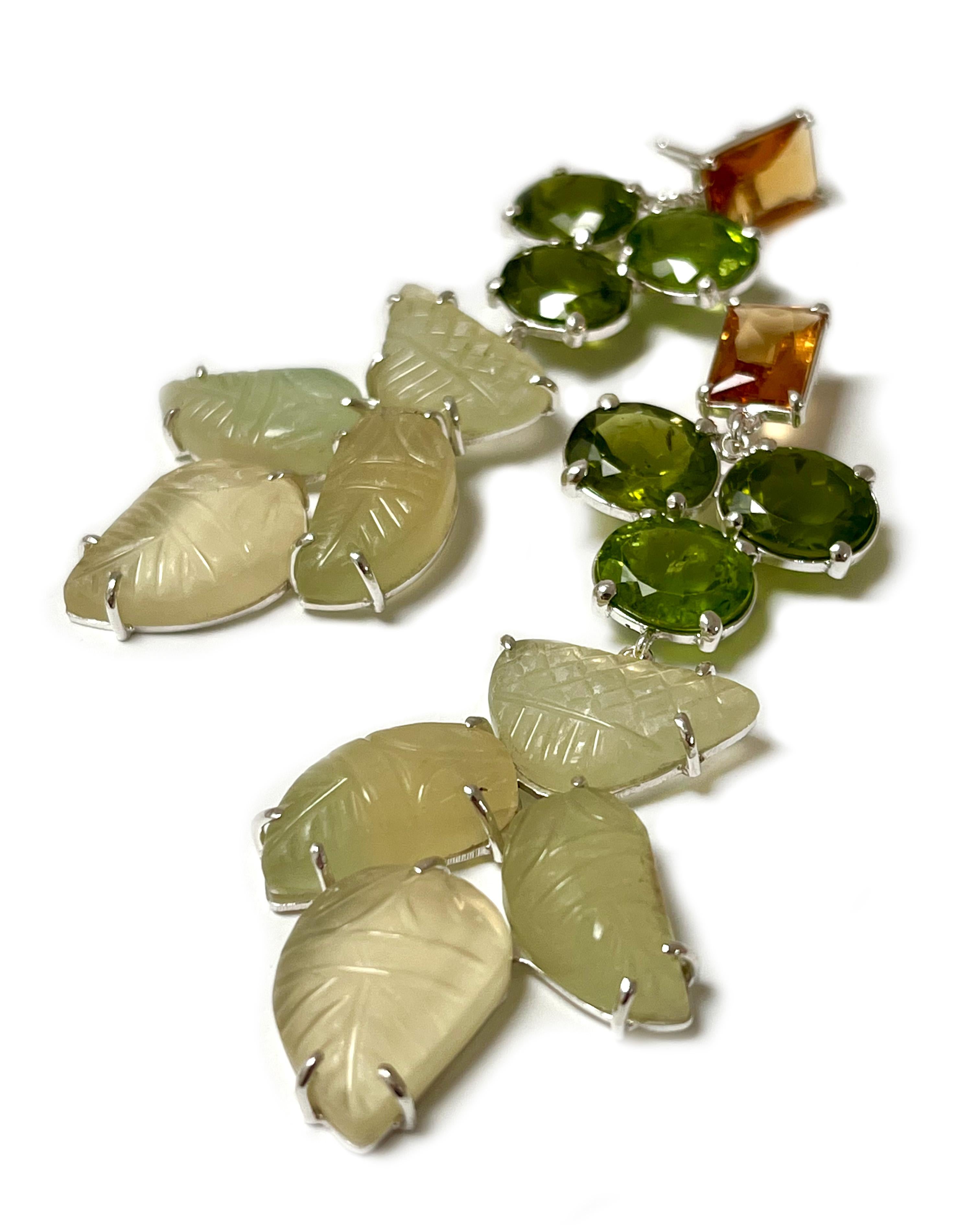 Intention: Foliage

Design: With warm orange, green, and off-white stones, these earrings are a nod to beautiful, tall and lush pine trees. 

Style Suggestion: ﻿These go with sunny days spent outdoors and a curiosity for nature. 

Particulars: