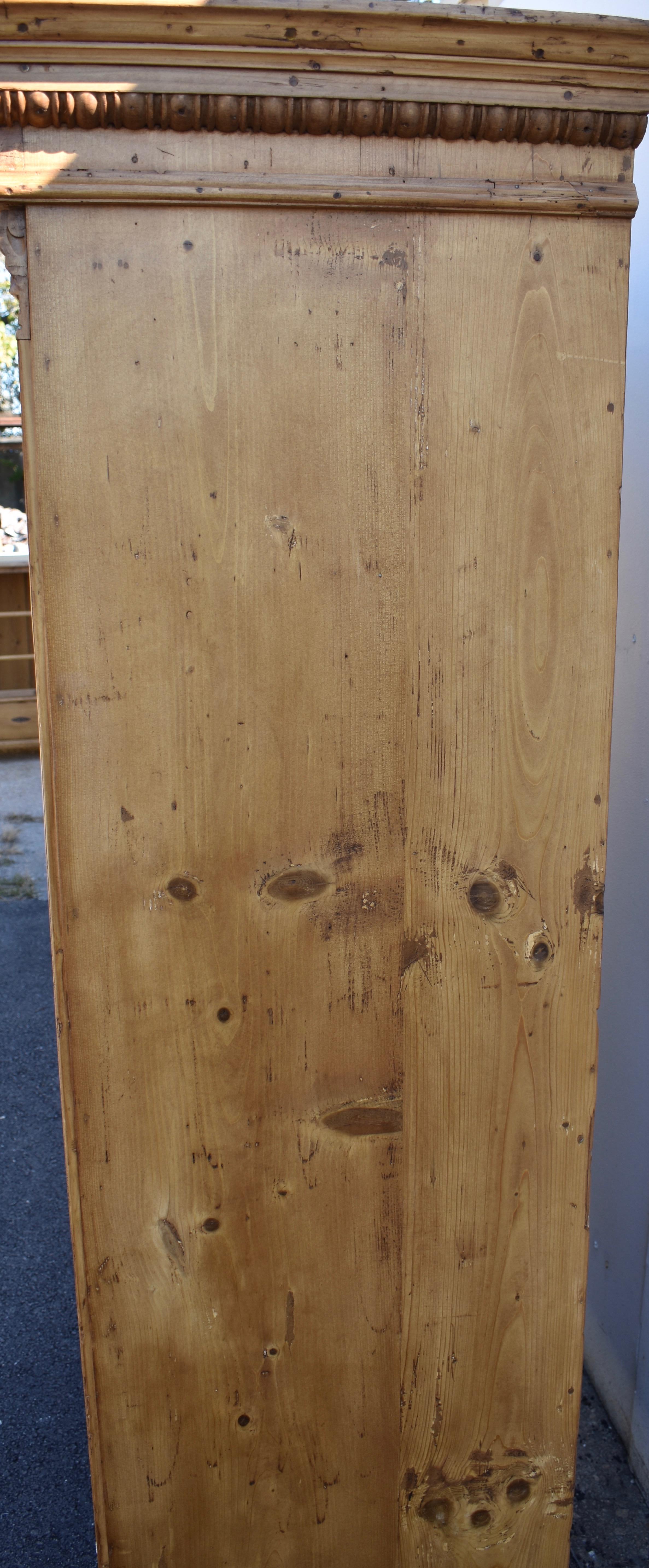Polished Pine Two Door Armoire with Carved Door Panels For Sale