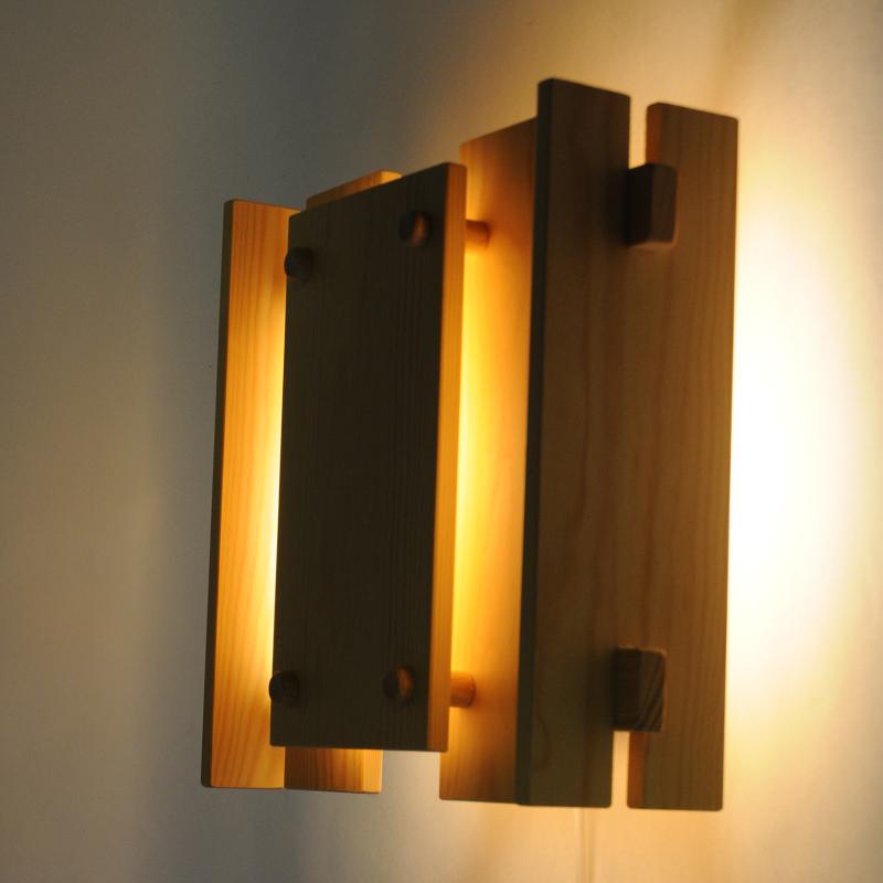 Very unique and special wall lamp made of pine wood. Has never been used.
This pine lamp was designed by Gunnar Næss in 1969 and produced by Høvik Verk in the 1970s. Gunnar Næss was both an interior architect and designer and made this model W3076