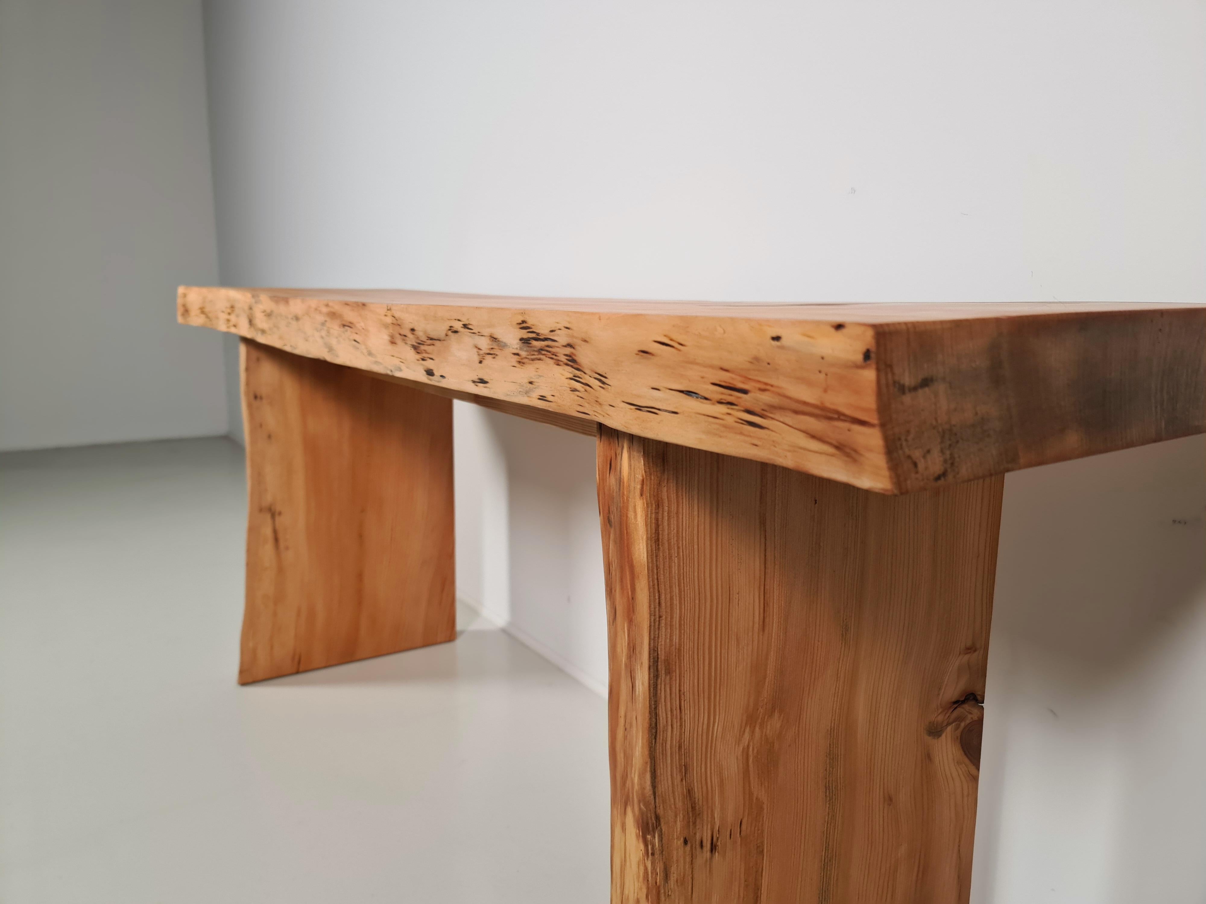 Pine wood console table, France, 1970s

Console table in the style of Pierre Chapo. Strong and simplified design which clearly emerges the woods grain and natural look. The rectangular tabletop, rests on a two-legged base. With characteristic