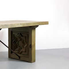 Pine wood table with wrought iron supports and star marquetry details on the leg