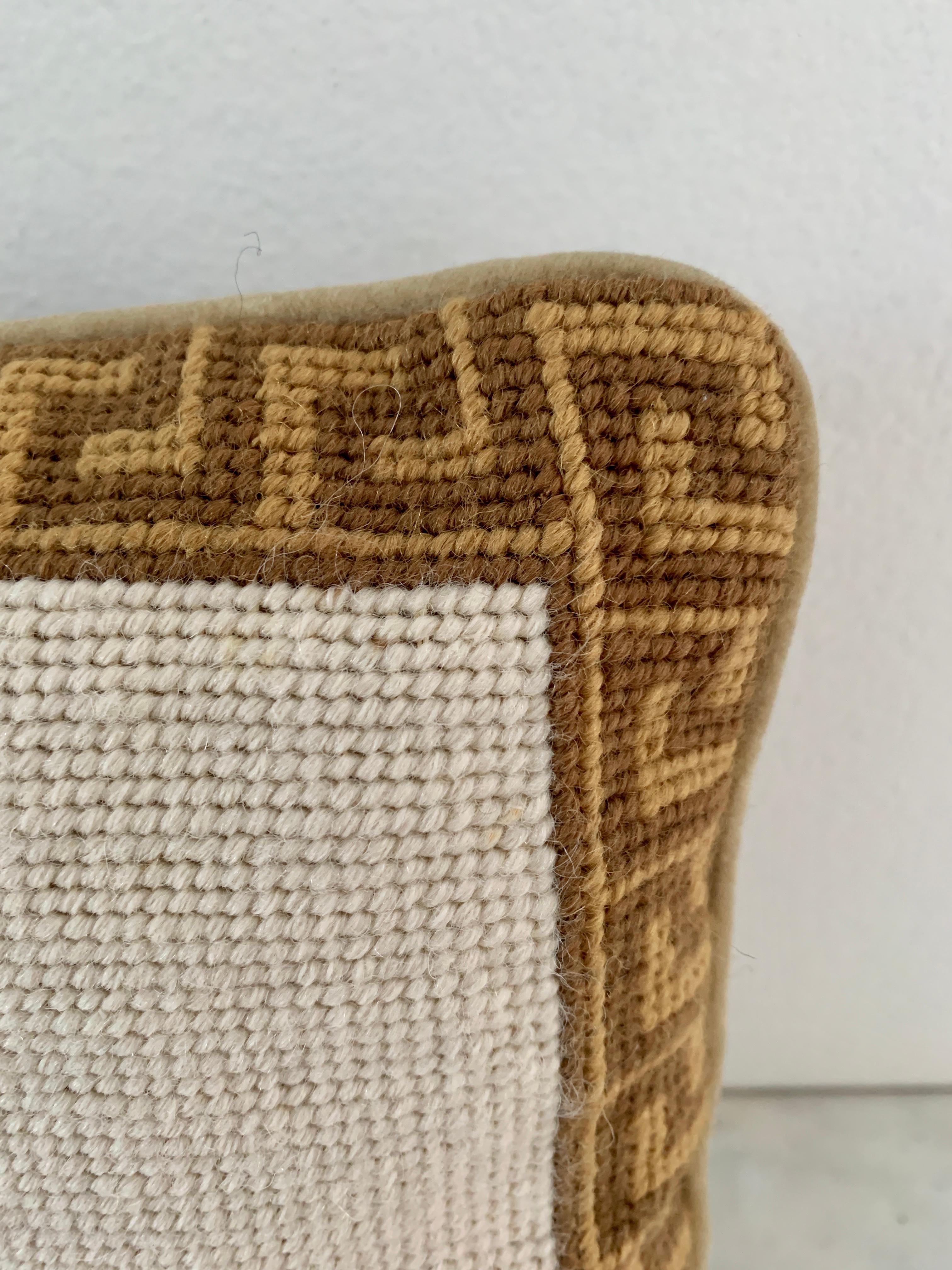 A charming decorative needlepoint throw pillow with a pineapple and Greek key border

20th Century

Measures: 9.25