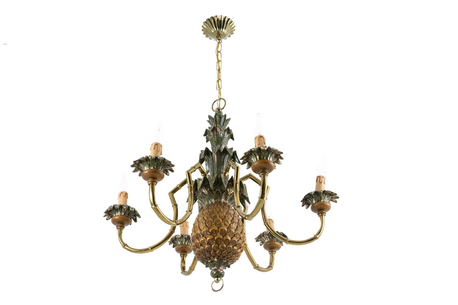 Pineapple chandelier in lacquered wood and gilt brass. Gadroons shape cache-bélière (hide hook). Central shaft decorated with a green and brown lacquered wood pineapple where six bamboo shape gilt brass arm light are hung. Cups with a lacquered