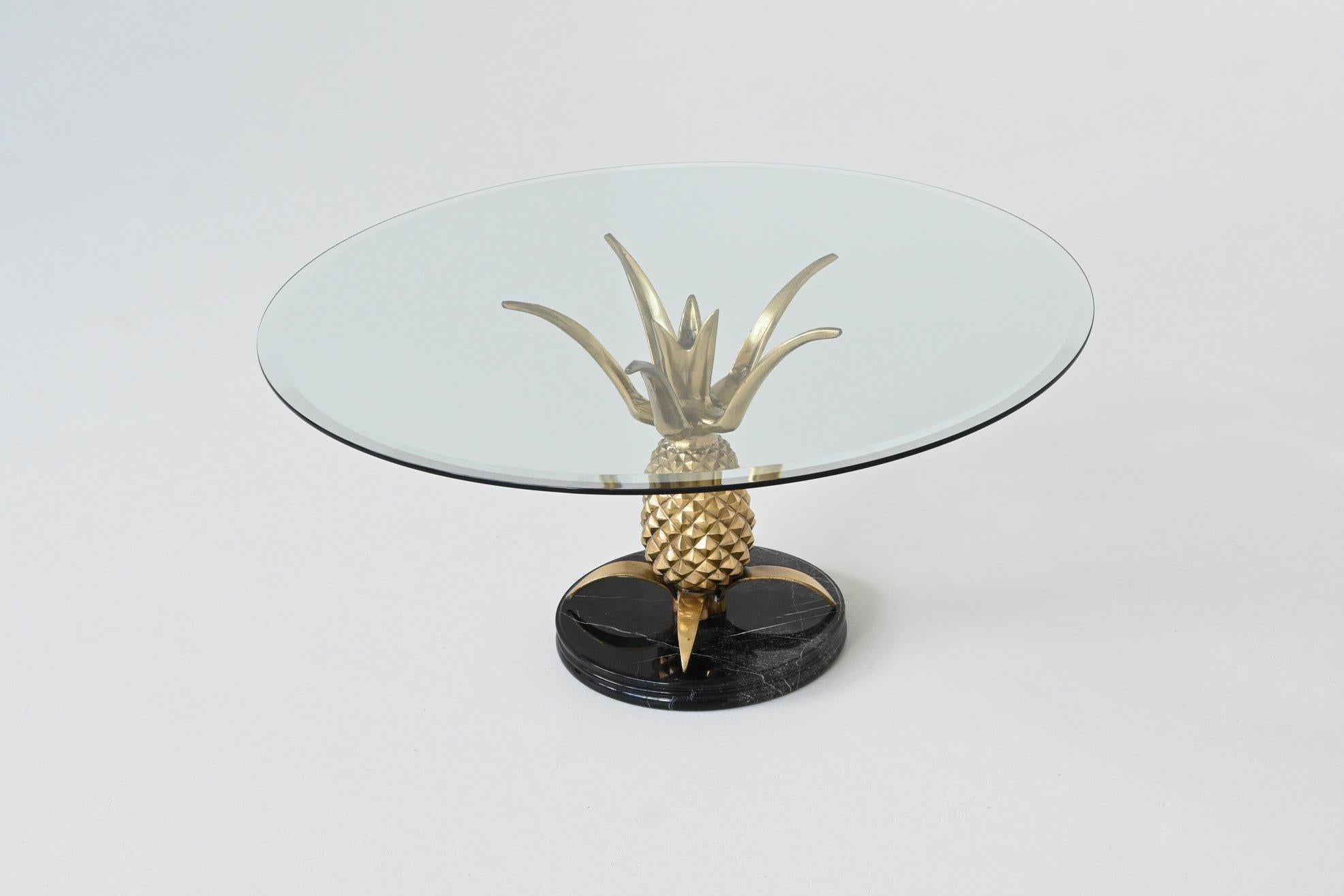 Beautiful eye-catching coffee table in Hollywood Regency style, France 1970. This table is fashioned in the shape of a pineapple on an elegant black marble base and with a facet cut glass top. This table is the perfect height to be used as a wine
