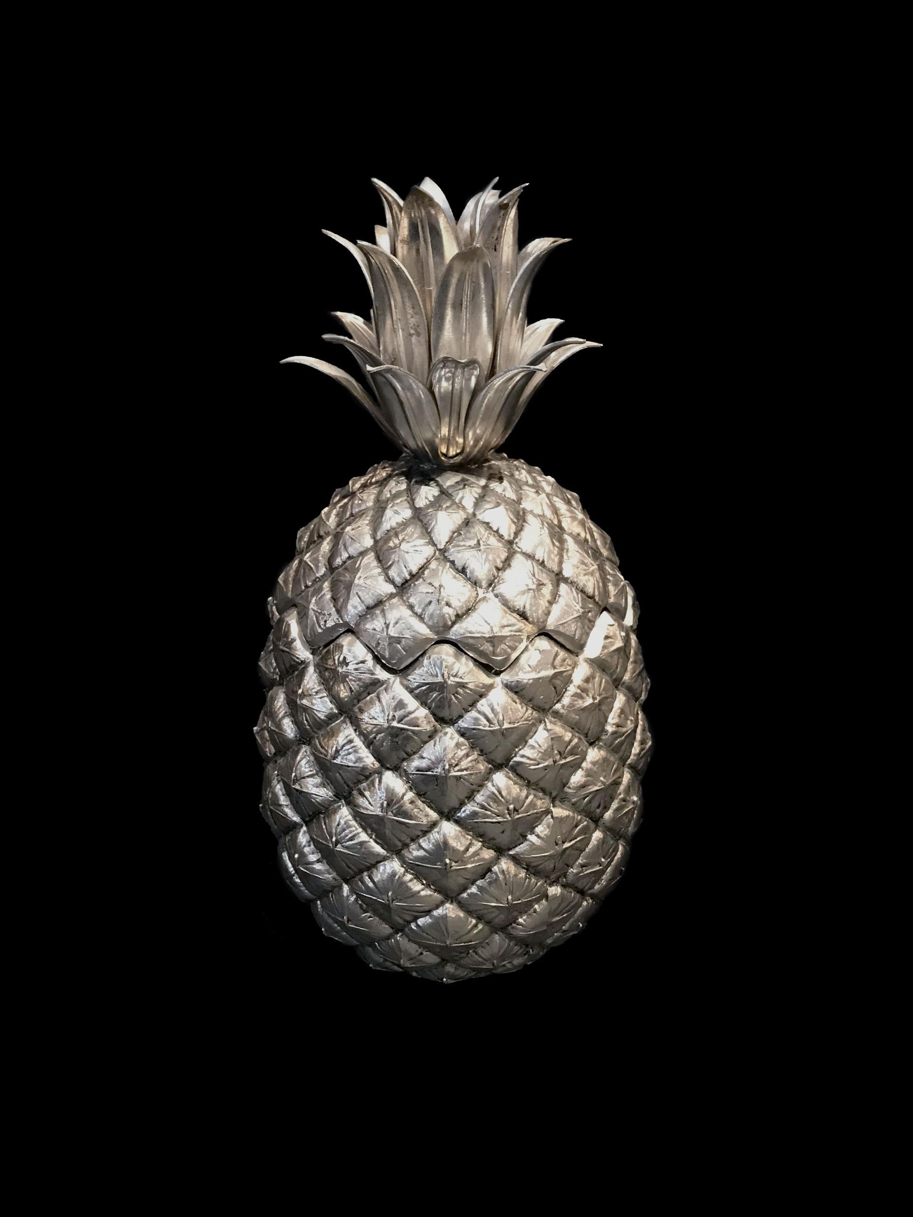 The pineapple ice bucket, designed by Mauro Manetti is world-famous and even has been copied many times !
The original and first productions had inside made of metal and the outside of silvered cast aluminum which is silver plated.
Mark beneath