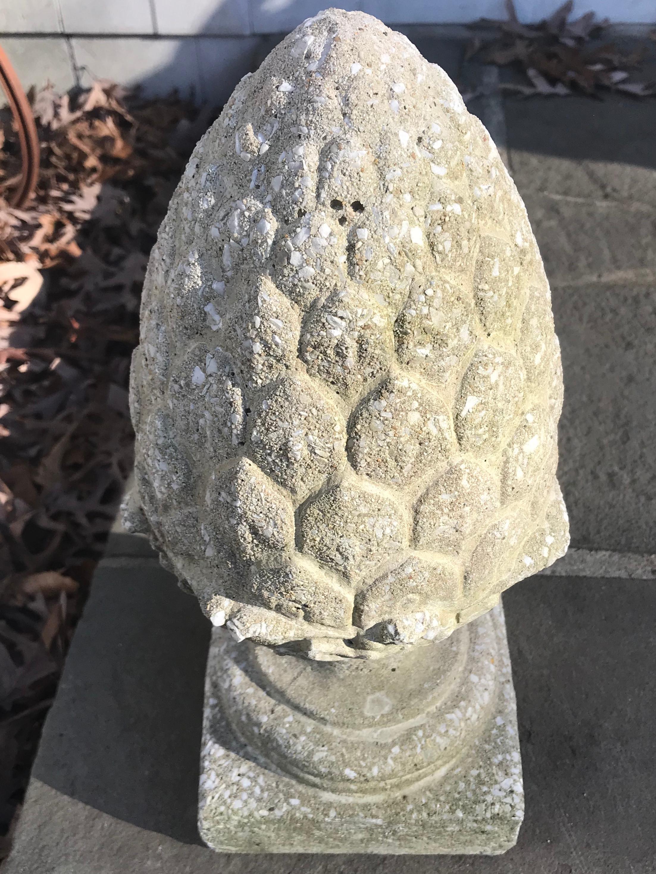 Pinecone cast stone finial. Vintage cast stone garden ornament finial in the form of an inverted pinecone or pineapple on socle base. Some small losses to out-turned leaves above base, otherwise in great vintage condition, United States,