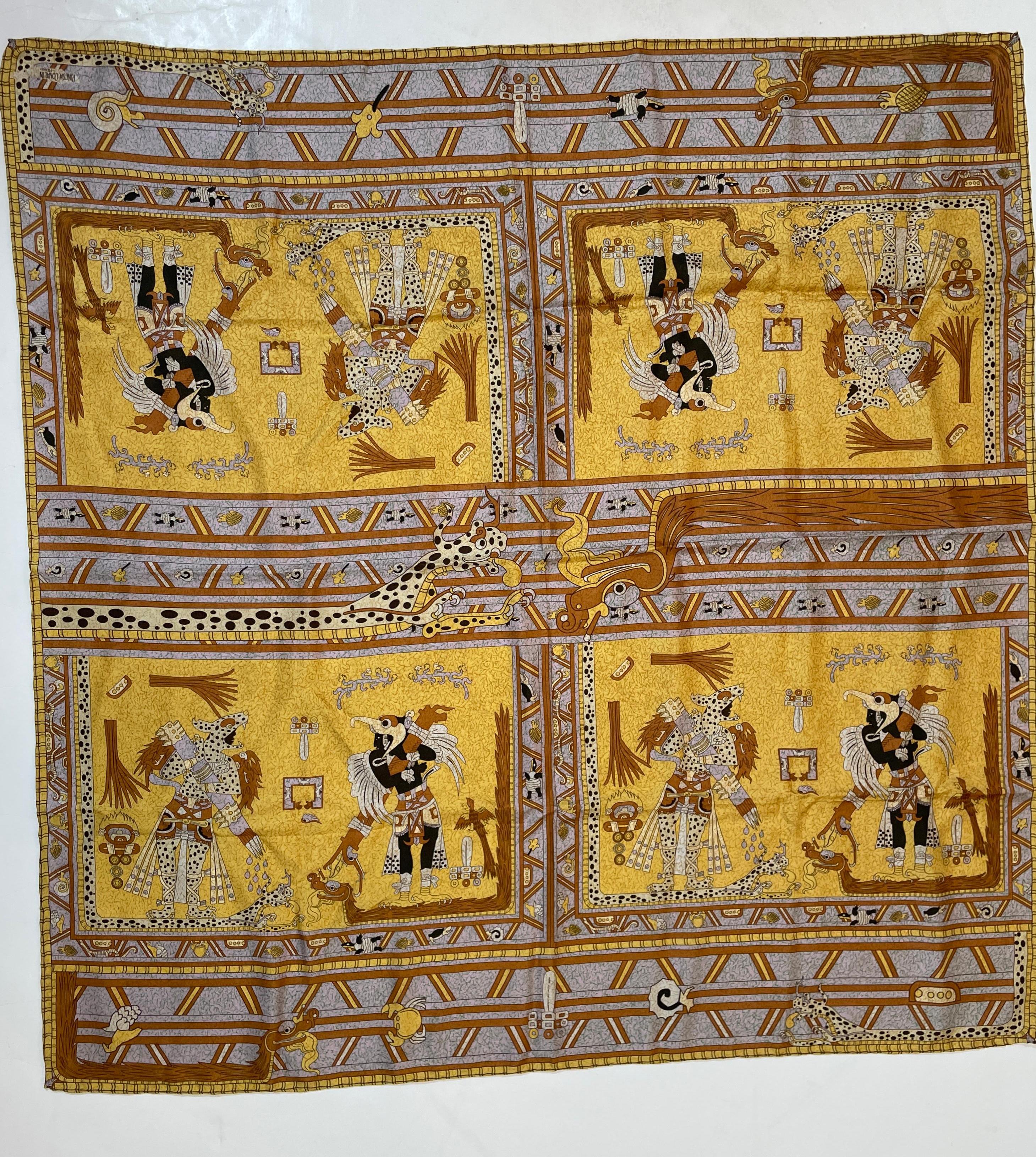 Pineda Covalin Signed Silk Scarf designed in Mexico with traditional Aztec Mayan design.
100 % silk hand rolled edges.
Great gold and brown colors.
100% silk scarf with colorful designs inspired by Mexican mythology, from magical places, fantastic