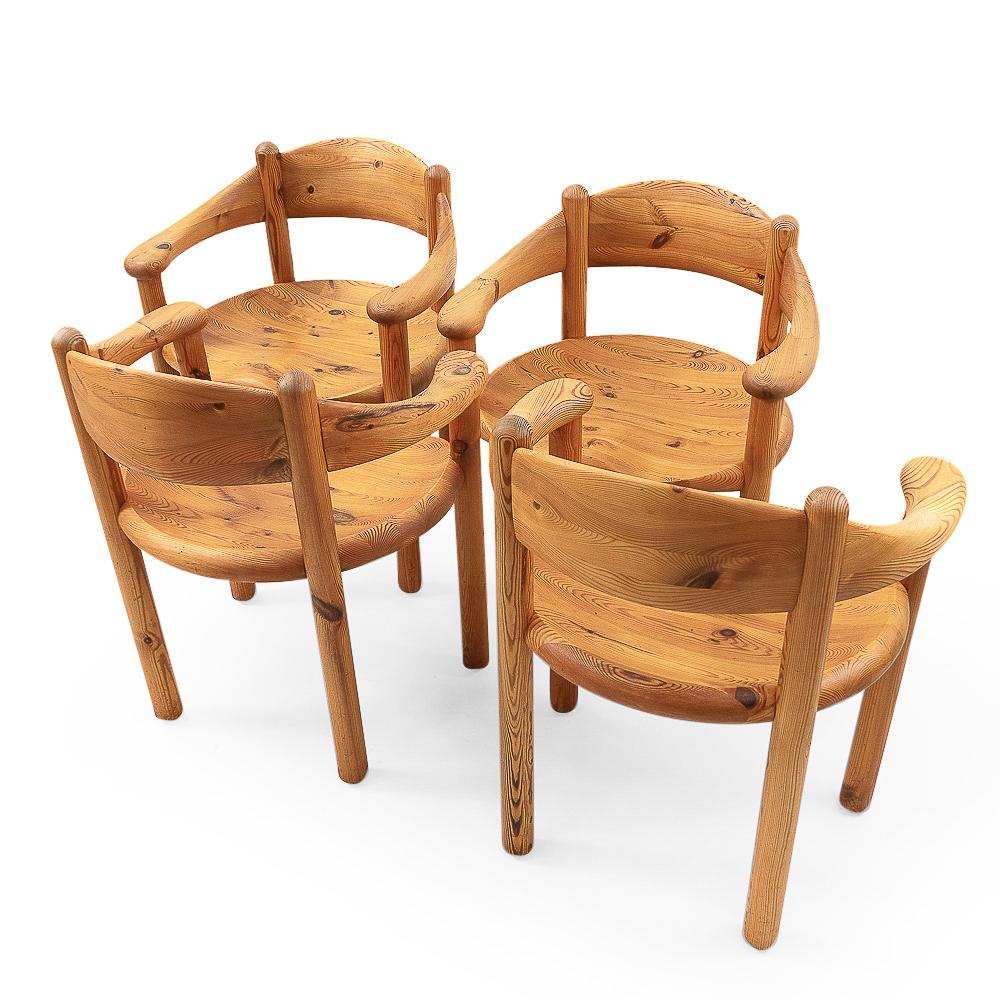 Four pine armchairs by the Danish architect Rainer Daumiller, produced by Hirtshals Sawmill during the late 1970s.

Solid wood and round curves, these chairs are quite comfortable to sit in. The wood has developed a wonderful patina over time.

