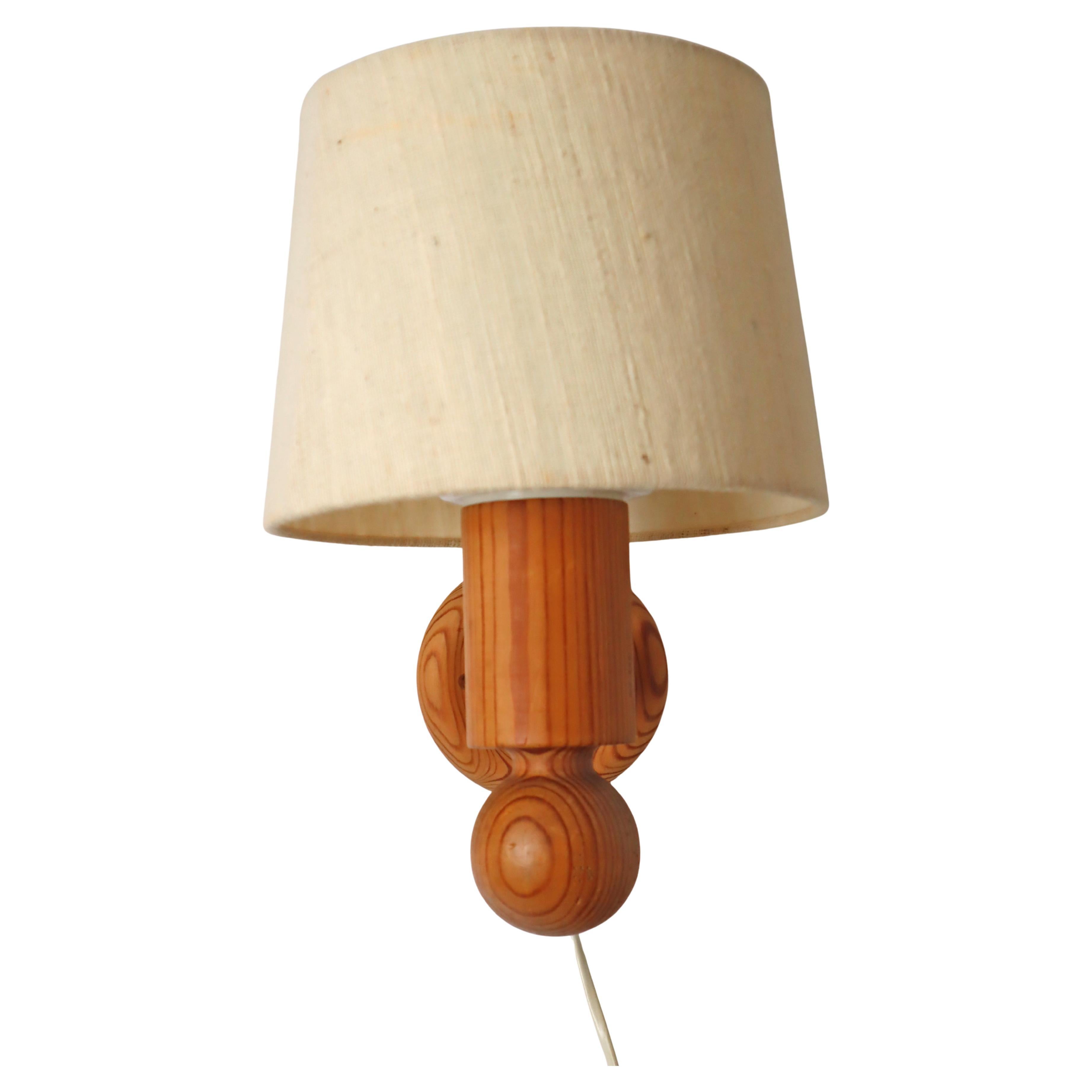 Pinewood wall lamp with lampshade from Luxus Sweden