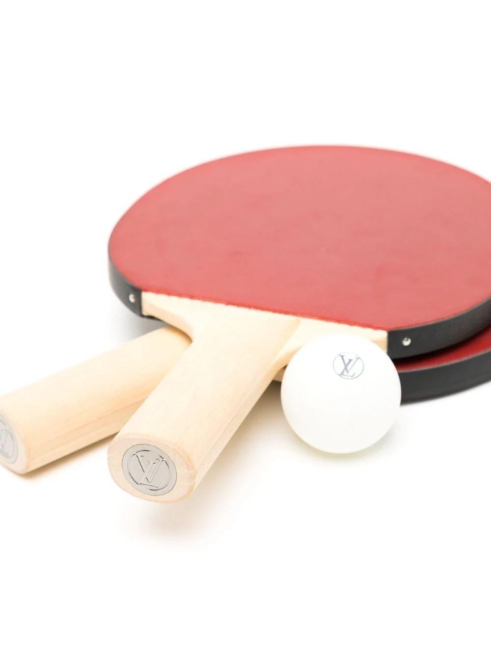 Uphold the rules of the game with this sophisticated Ping Pong Set from the James Monogram Eclipse Collection. This portable set includes two professionally designed Ping-Pong paddles, two regulation balls in a custom holder, and an exclusive cover