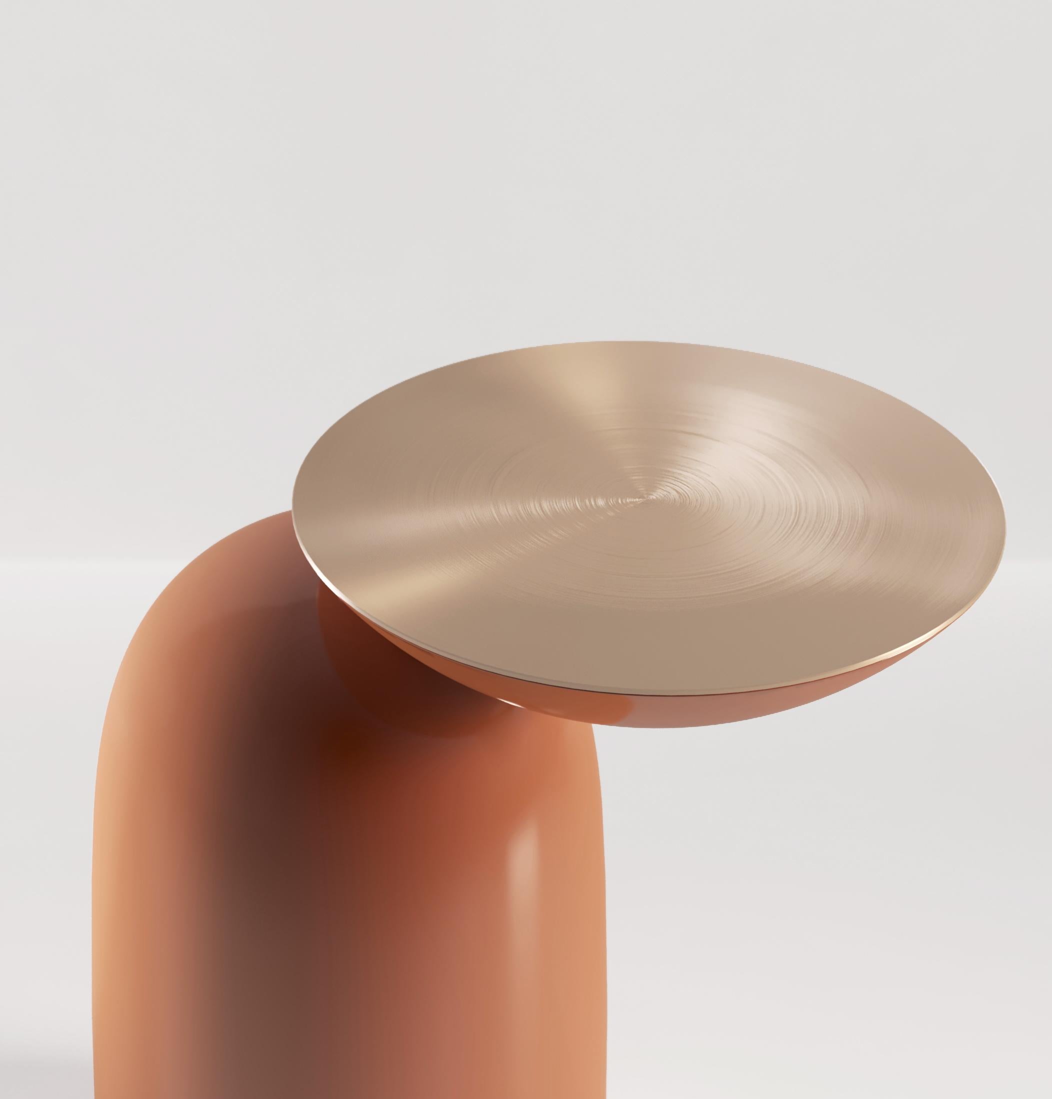 Pingu is a playful addition to any room, offering up a place for a drink or an ashtray beside your chair. An inverted dome is supported by a soft-shaped base which it is barely touching. A metal top adds a touch of luxury. Pingu is available in any