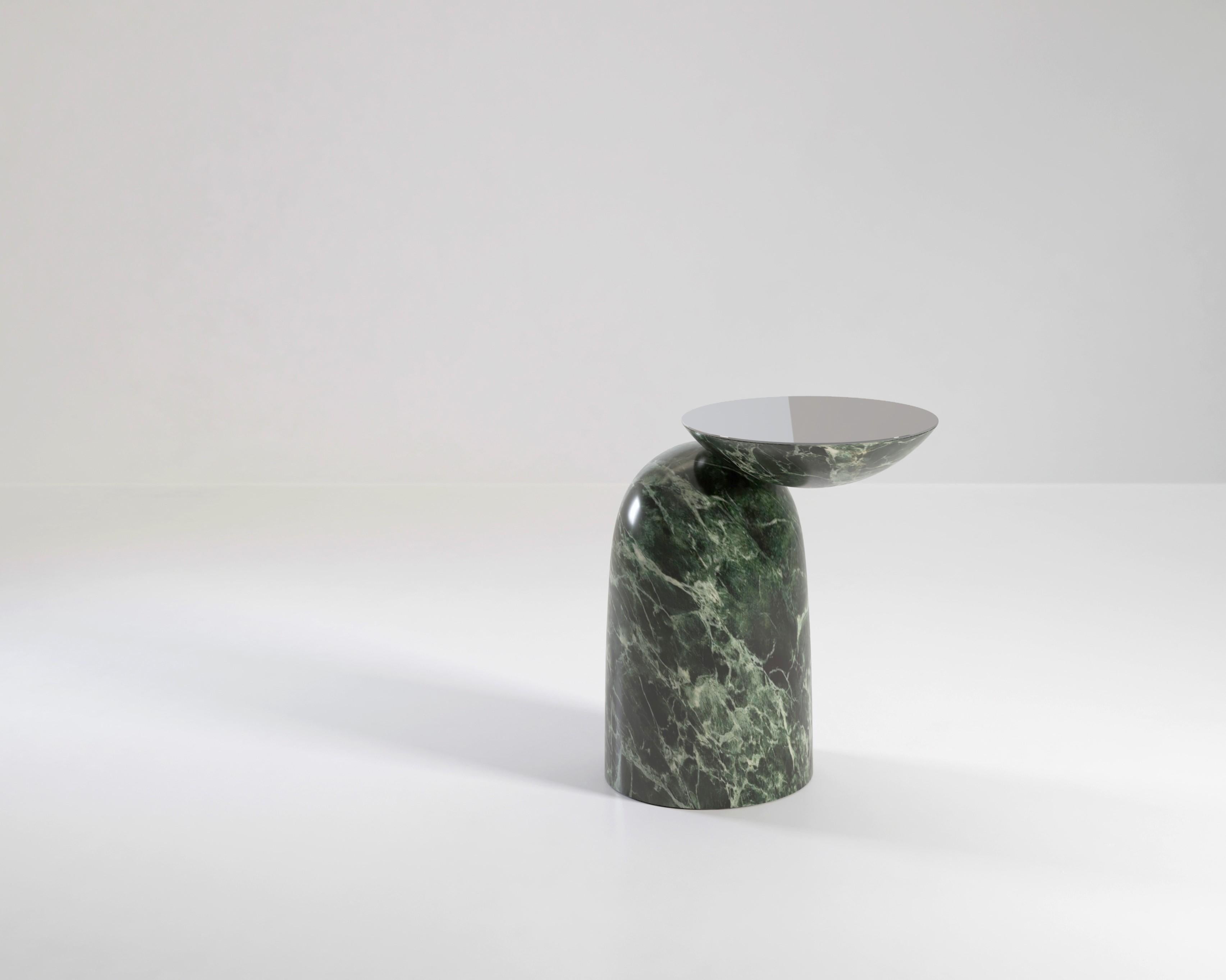 ?Pingu is a playful addition to any room, offering up a place for a drink or an ashtray beside your chair. An inverted dome is supported by a soft-shaped base which it is barely touching. Pingu X is available in standard and premium marble finishes,