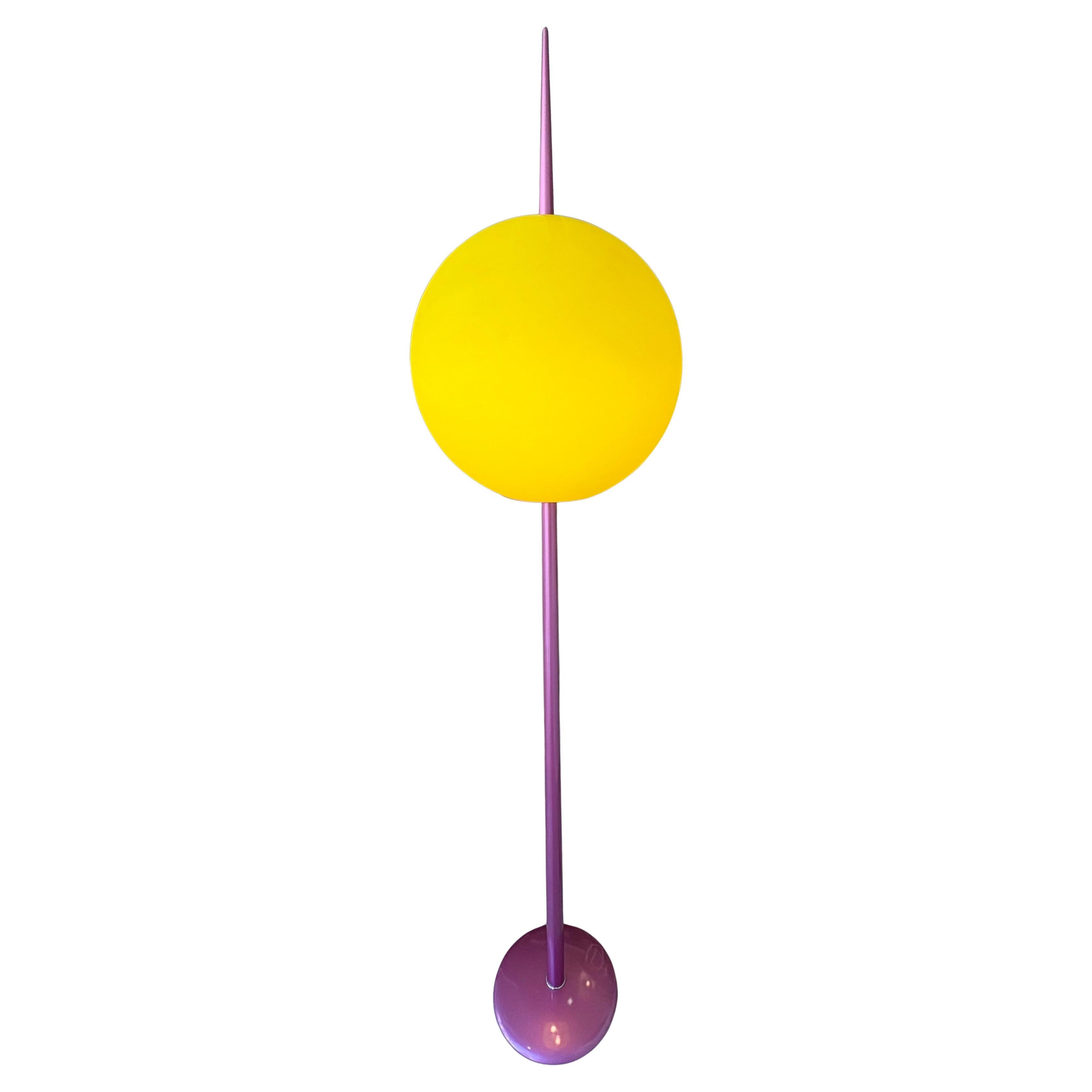 Wonderful and very rare Post-Modern 1980s lamp by Targetti. 
In superb condition with a spray painted neon pink stem culminating in a spike and suspended within a large bulbous lemon yellow Murano glass  shade . A superb piece to make any room and a
