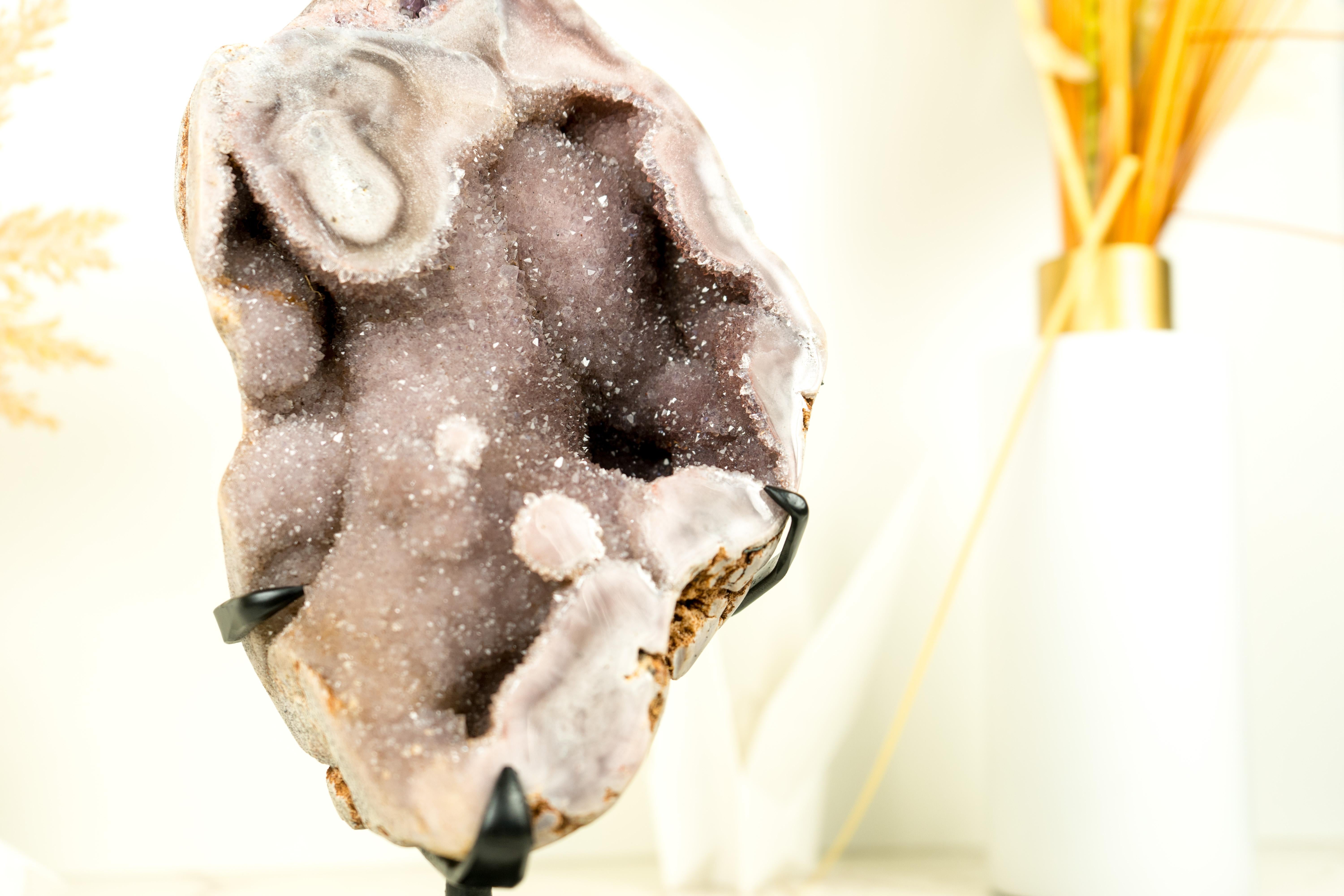 So rare, this Pink Amethyst showcases a unique form of Pink Galaxy Amethyst Druzy that creates a mesmerizing luster effect. This one-of-a-kind natural artwork will bring elegance and exclusivity to your crystal collection, home, or office