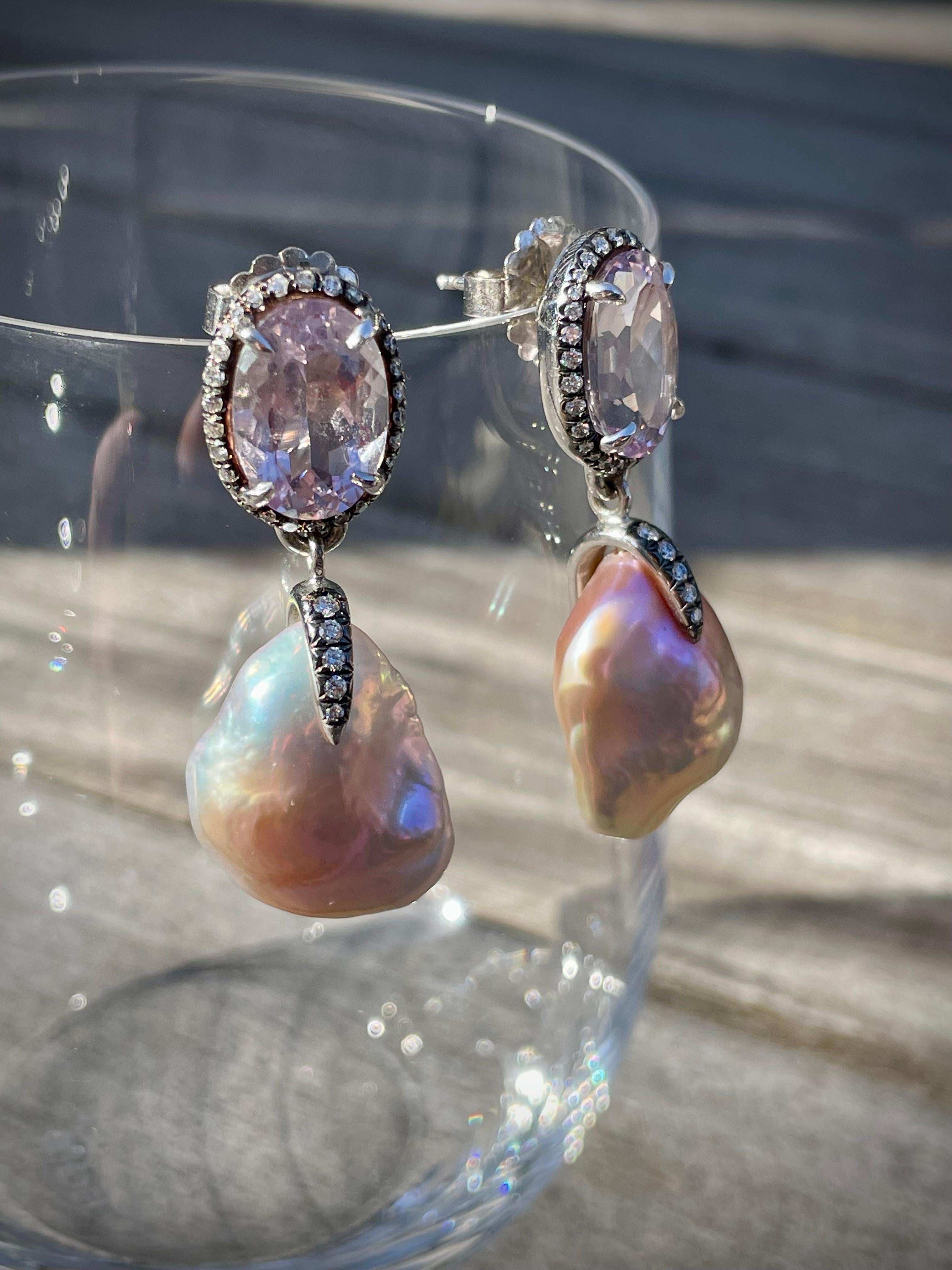 Over 7 carats of faceted oval Rose de France sit on the ear surrounded by diamond halos. Soufflé freshwater pearls with an intensely metallic lavender luster drop below held by a pavé claw. Secure posts and large backs, all set in sterling silver