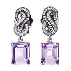 Boucles d'oreilles et bague en platine avec améthyste rose et diamants blancs