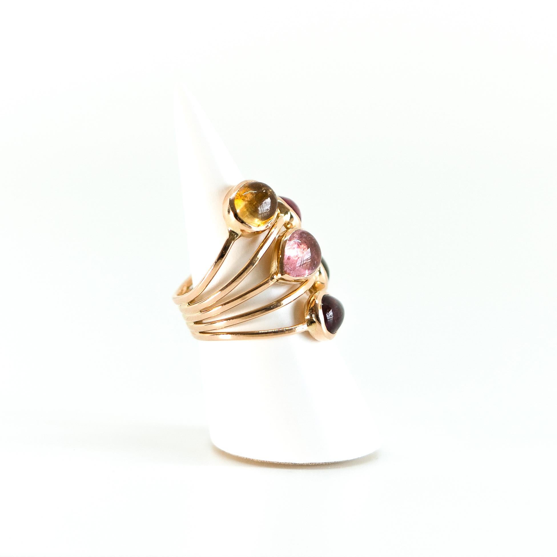 Pink, purple, beige and yellow colours for this beautiful and vomuminous ring.
Subtile palette of colour cabochons, all tourmaline stones.
18K pink gold ring. Finger size: 51  or 5 3/4
can be adjusted
Tourmalines total weight: 8.05 carats.
Created