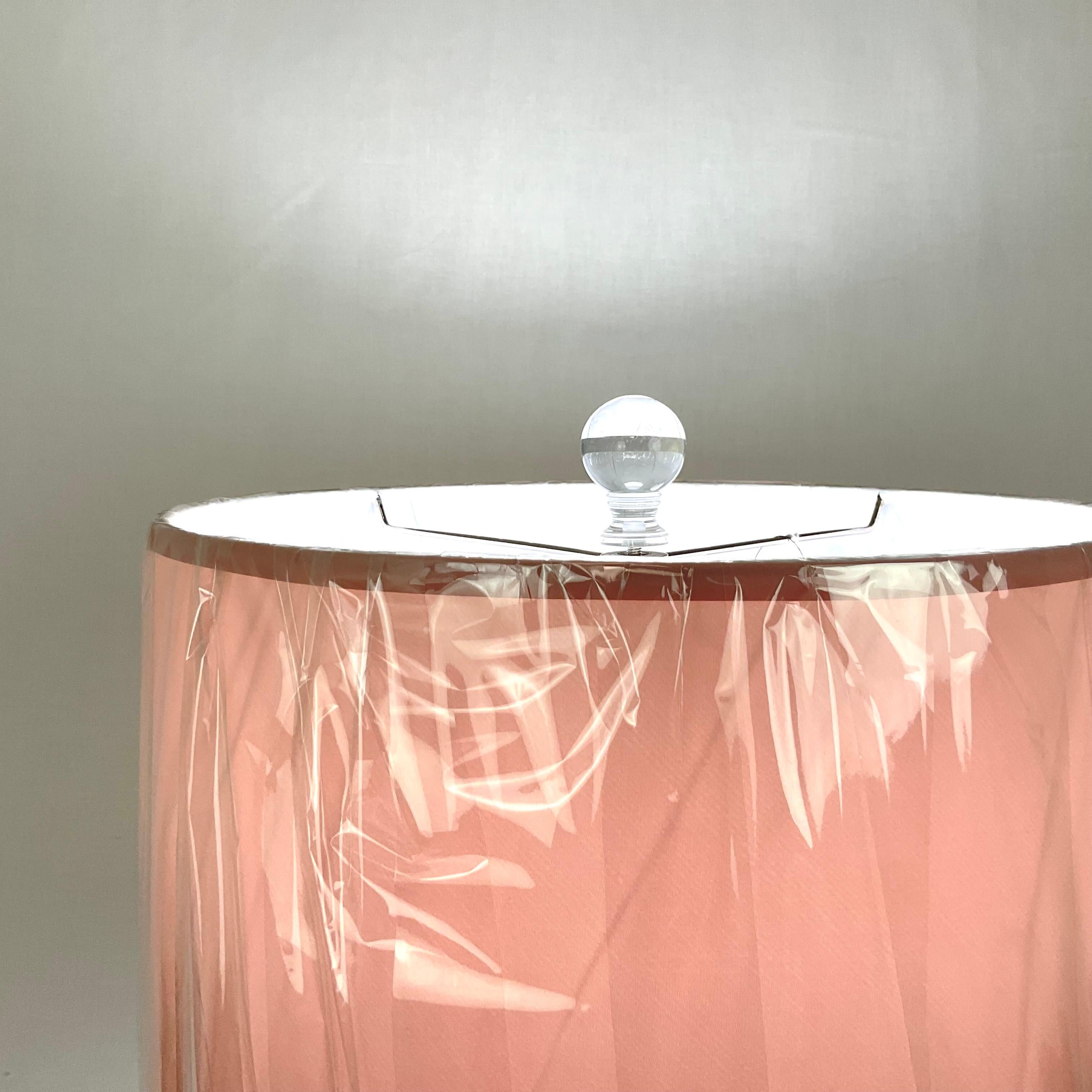 Amazing Pink and Black Murano Glass Table Lamp with Lucite parts. Art Deco/Modern styling and super nice quality. Tiered lower base adds to the charm. Black Murano Glass disk layered with Lucite breaks at the top give a quintessential deco style.