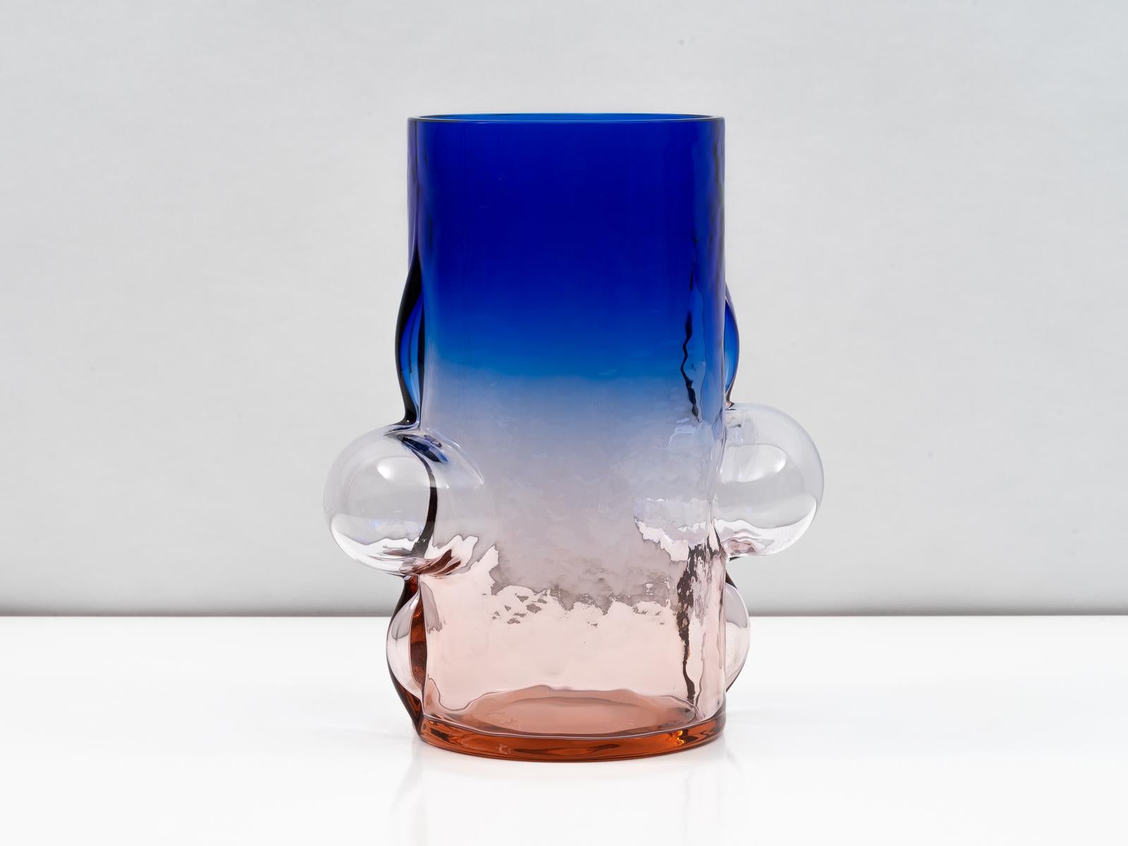 An exceptional vase designed by Toni Zuccheri for VeArt in 1988. The intensely-colored body transitions from purplish-pink at the base, to clear at its center, and then a deep ultramarine blue at its apex. Demonstrating the skill and craft of