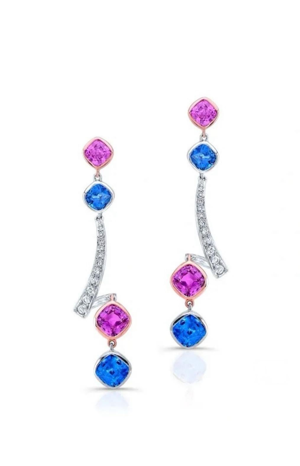 This magical pair of earrings toasts the cohesion of design. Four pink sapphires totaling 3.53 carats and four blue sapphires totaling 4.06 carats are beautifully adorned by 0.36 carats of white diamonds, magnifying the glow to these 18K white with