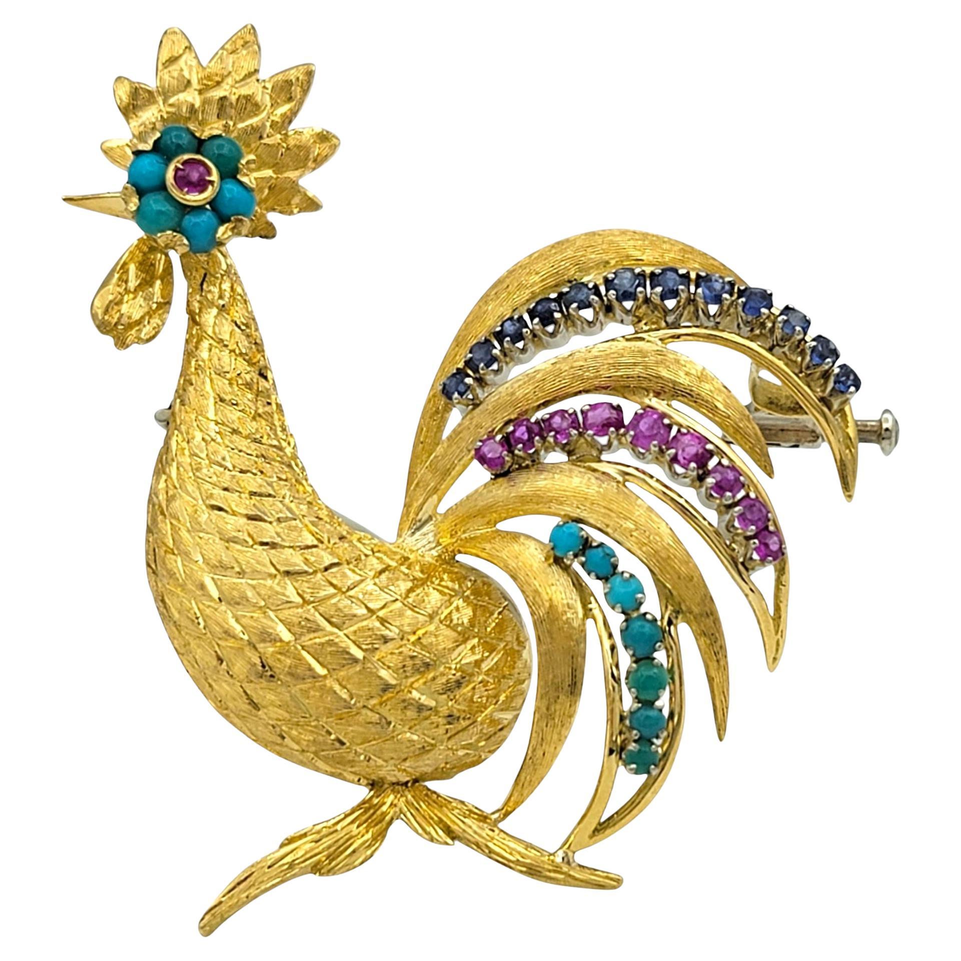 A striking work of artistry, this vintage-inspired rooster brooch is a captivating fusion of vibrant gemstones and exquisite craftsmanship. Sculpted in 18 karat yellow gold, the brooch showcases intricate texturing that mimics the natural feathers