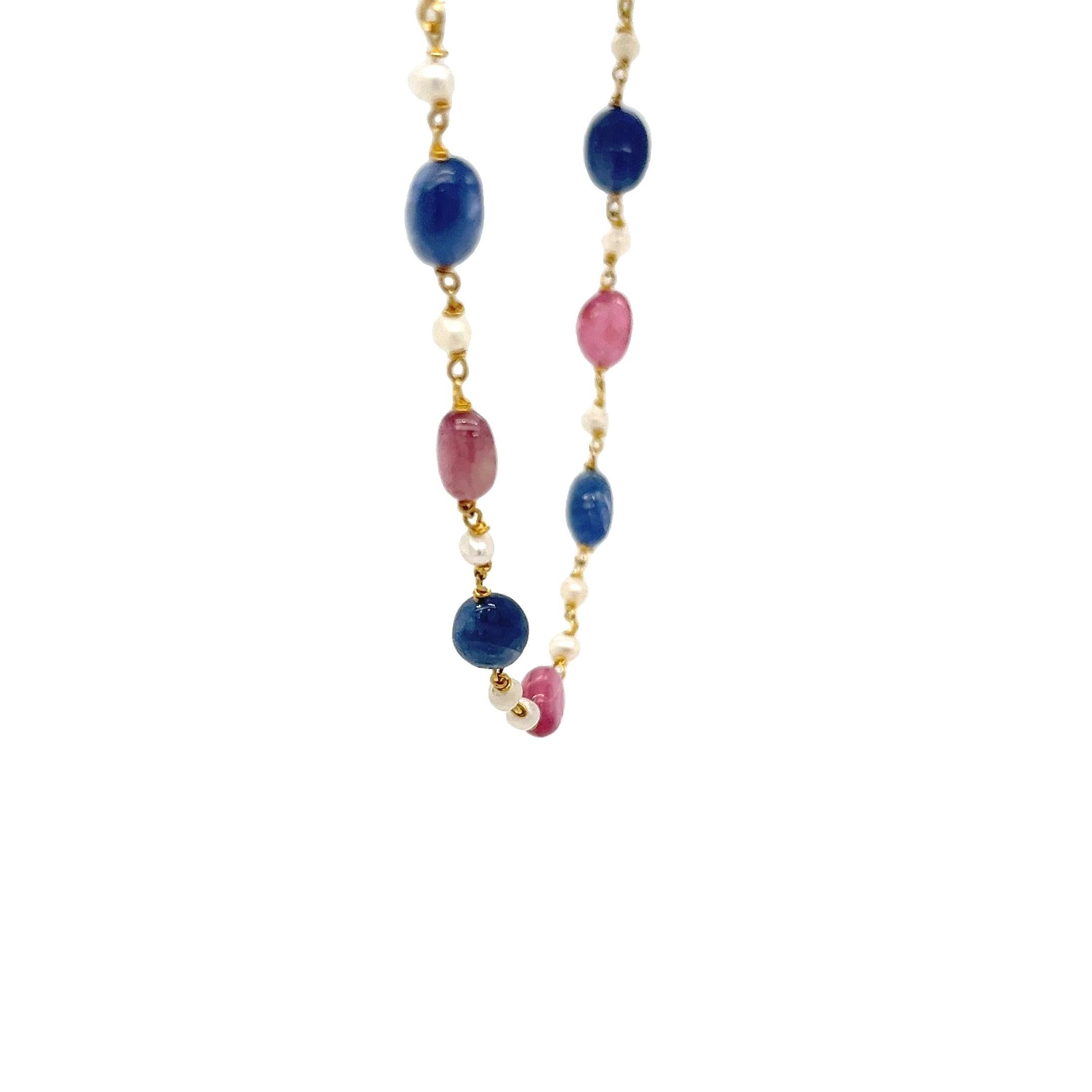 18 karat yellow gold necklace featuring 8 blue and 7 pink tumbled sapphires accented by 2.6mm cultured pearls. 20 inch box chain with S clasp. Finished weight is 8.0 grams.