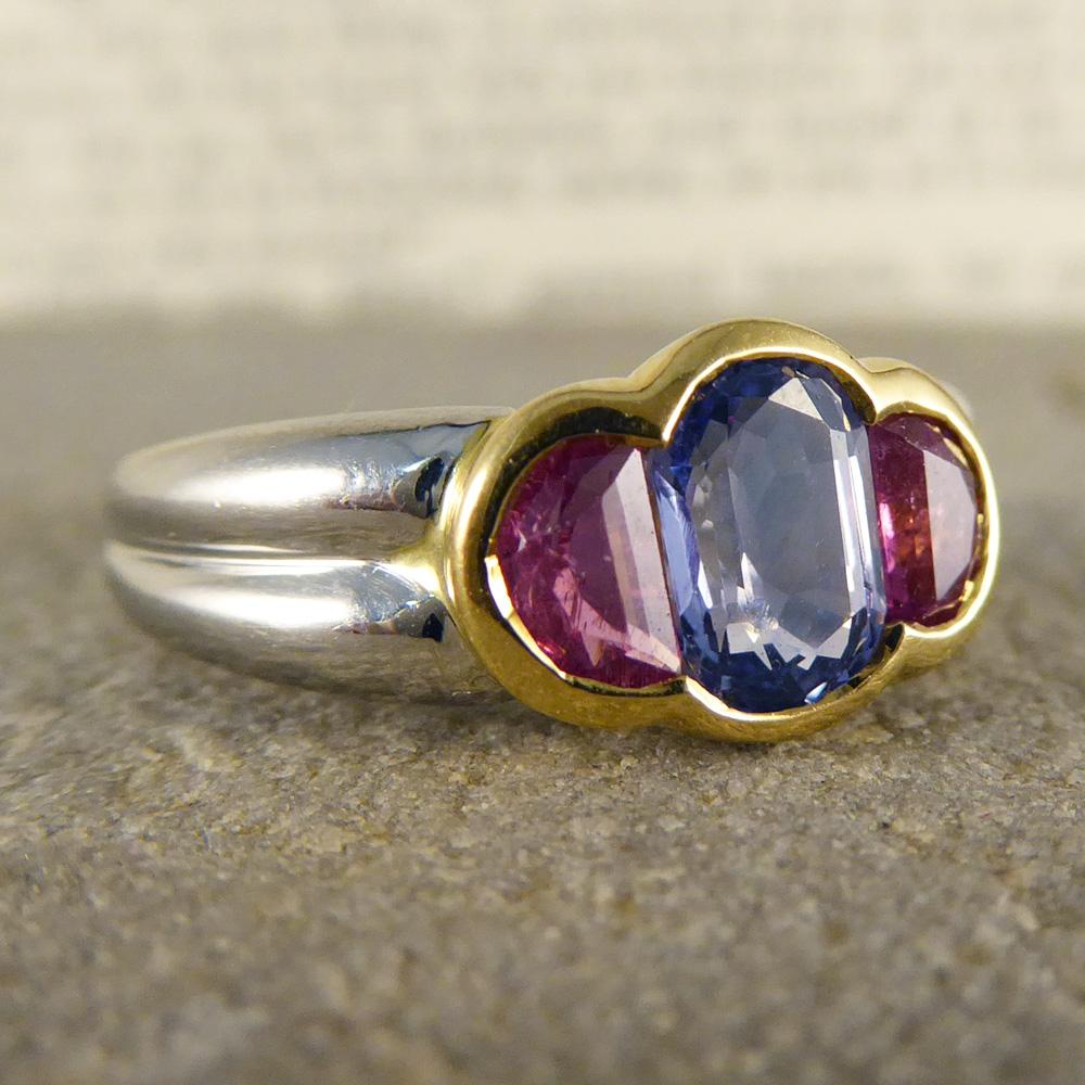 This contemporary ring shows gorgeous pastel colours through two pink and one blue sapphire stones set in a yellow gold mount. In a platinum band, this funky piece looks radiant on the hand!

Ring Size: UK M or US 6 

Condition: Very Good, slightest