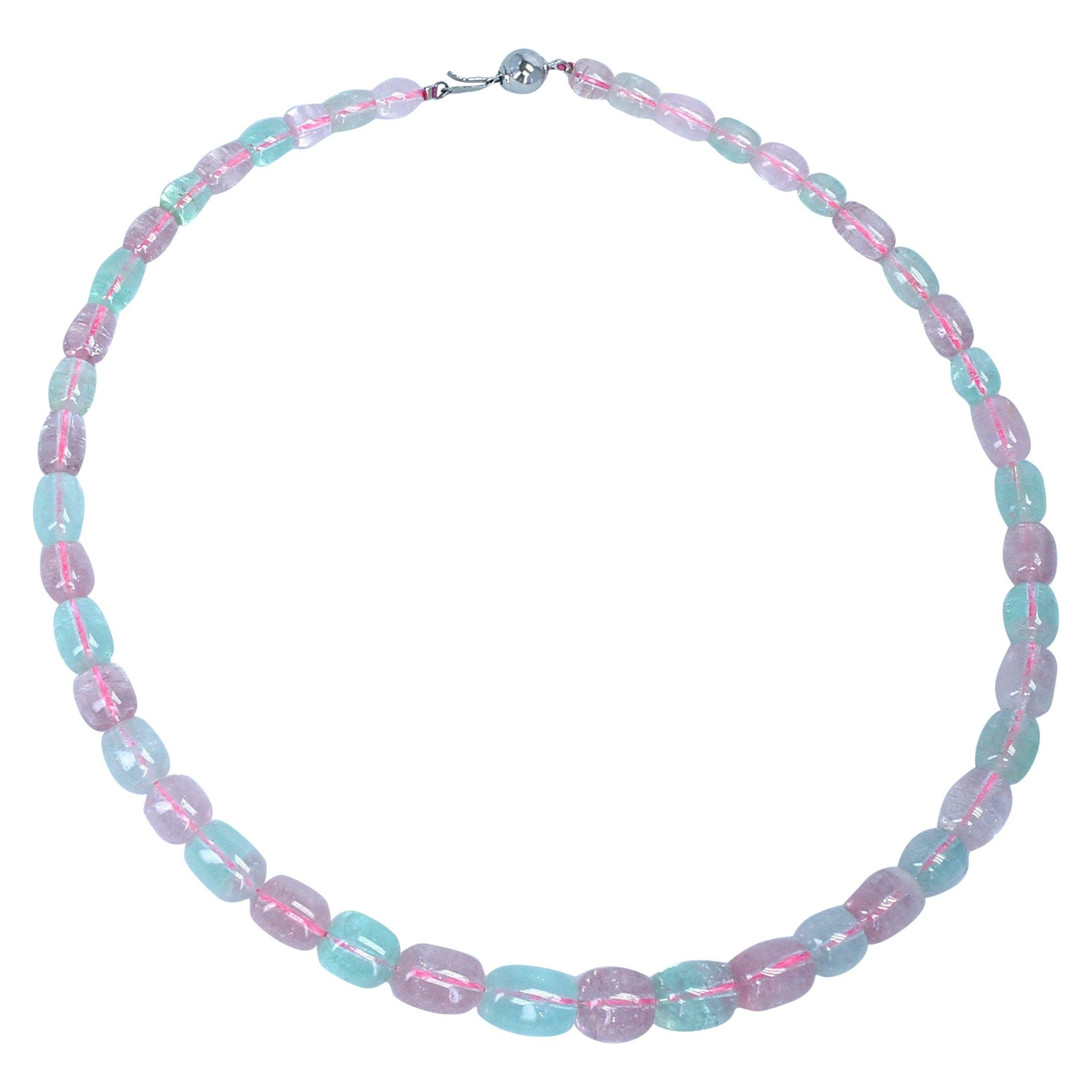 A strand of Pink and Green Smooth and Tumbled Tourmaline Beads, 14K Clasp. Clasp can be changed according to preference. Length: 20 Inches, Bead Range: 7MM to 15MM, Total Weight: 400 carats.
