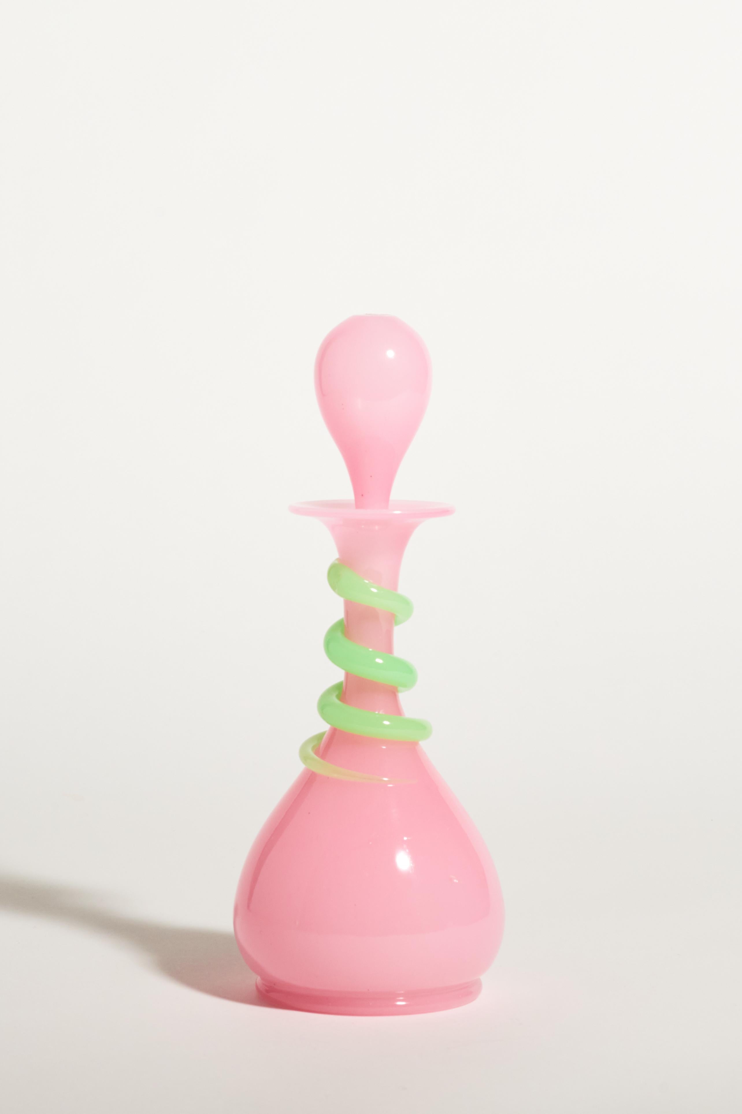 Blush pink classically shaped decanter with pale green applied glass snake coiled around the neck.
