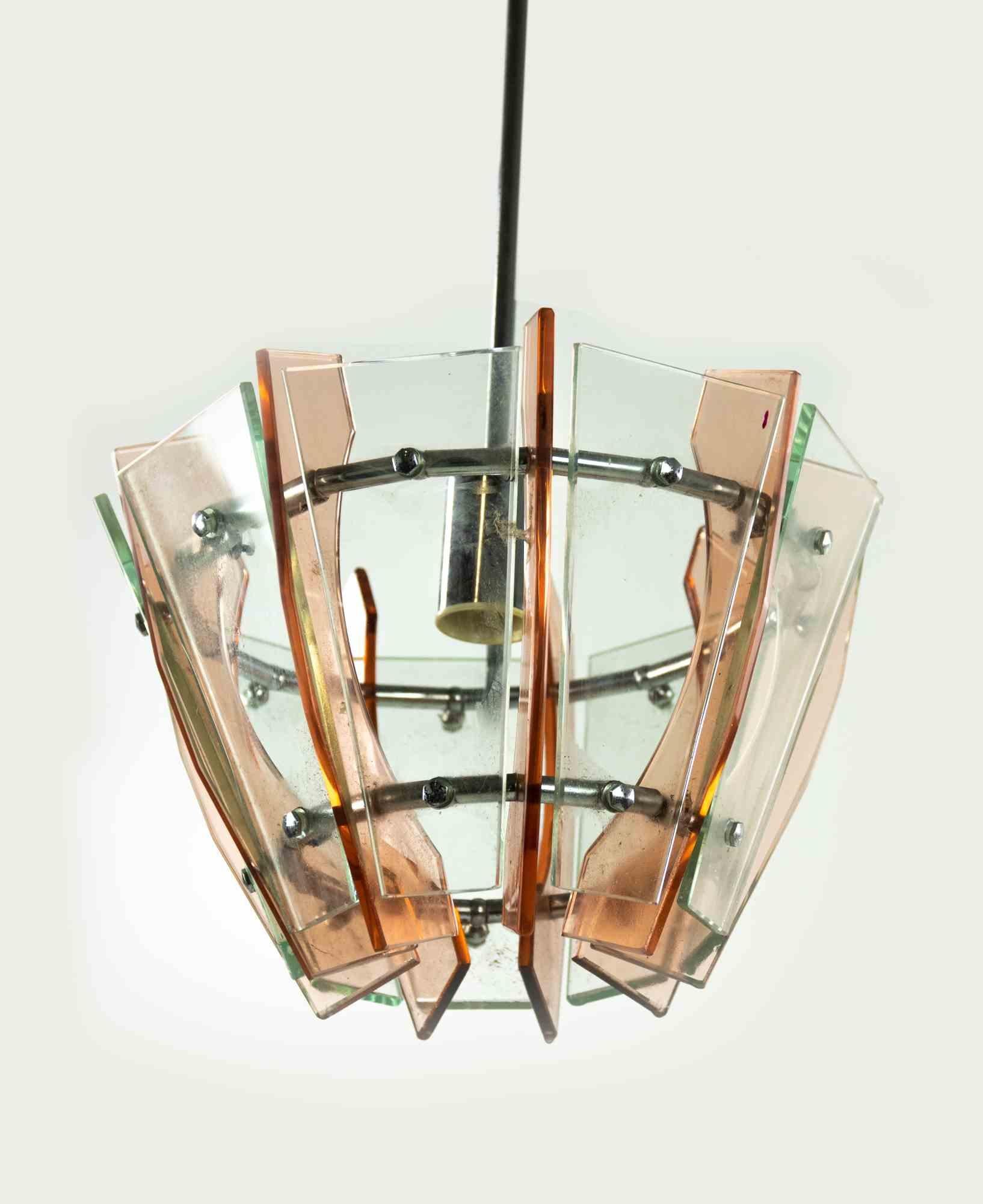 Pink and Green Chandelier is an original design lamp realized by Anonymous designer in the 1970s.

A vintage lamp realized in light green and pink colored glass.

Mint conditions.

This chandelier is perfect to give a touch of unicity to your
