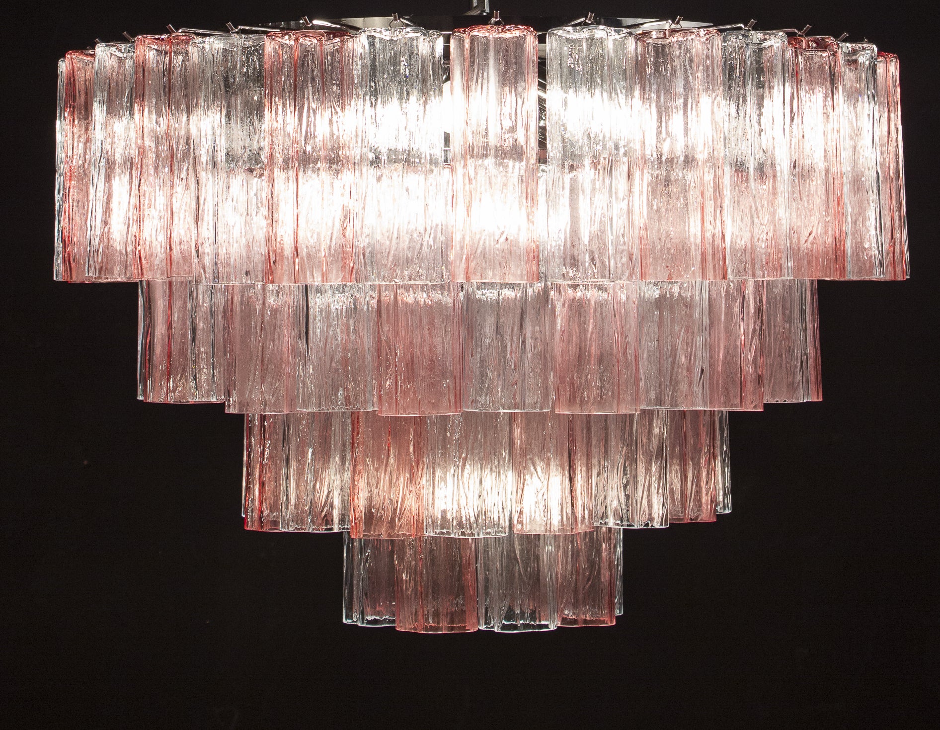 This extraordinary chandeliers is composed by 78 pink and ice color Murano glass 'Tronchi'
by 20 cm high.
 Available also the pair. 
There are 10 E27 light bulbs . 4W . We can wire the fixture for your country standards, 
 Adjustable height, by