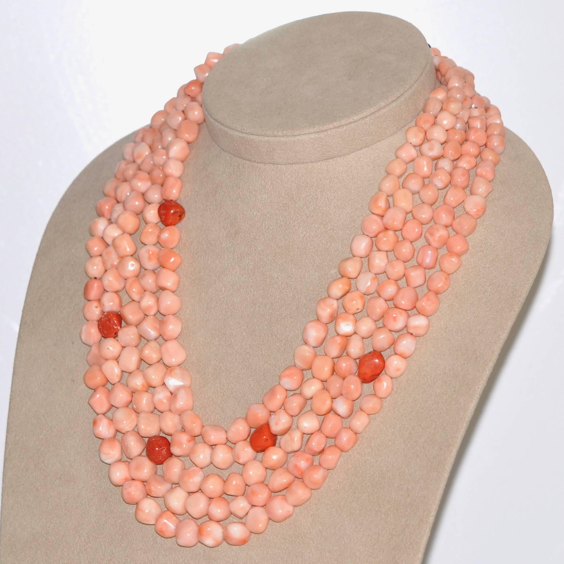 Discover this Pink and Red Coral, Bakelite Multi-Strand Necklace.
Pink Coral
Red Coral
Bakelite Clasp

