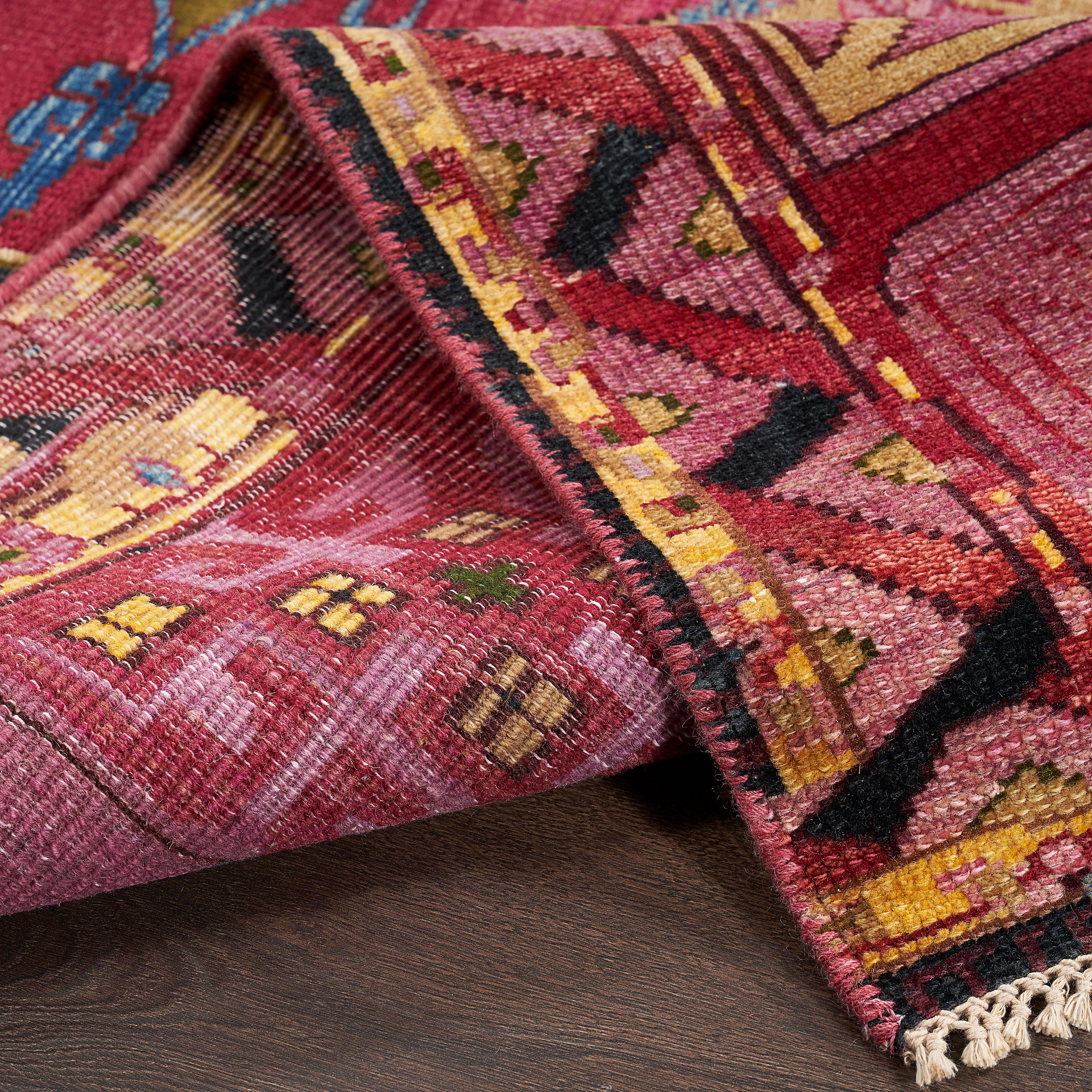 Hand-knotted in Jaipur with fiber spun from recycled sari silk and wool, this Alchemy rug reimagines an Agra pattern in a striated palette made luminous by sun power, low-impact dye, and closed-loop water washes. Through innovative technique and
