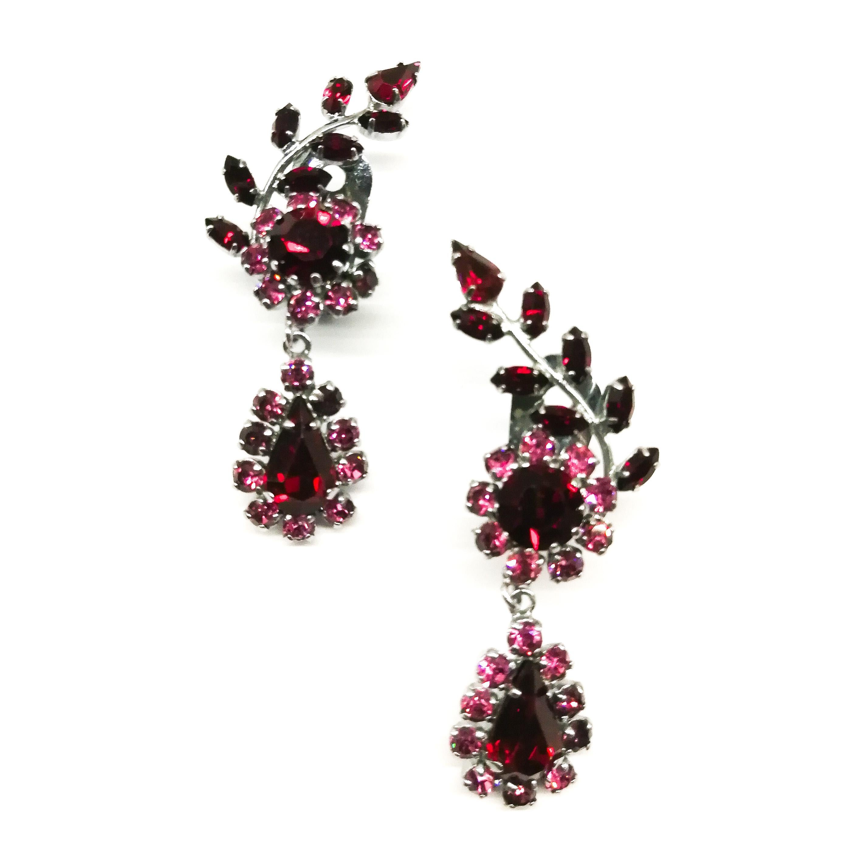 Delicate and eye catching earrings, with the 'leaf' going up the ear, and a tear shaped drop hanging down, all catching the light. The pink and ruby stones  highlight each other beautifully.
Perfect and so easy to wear with a simple sweater, a