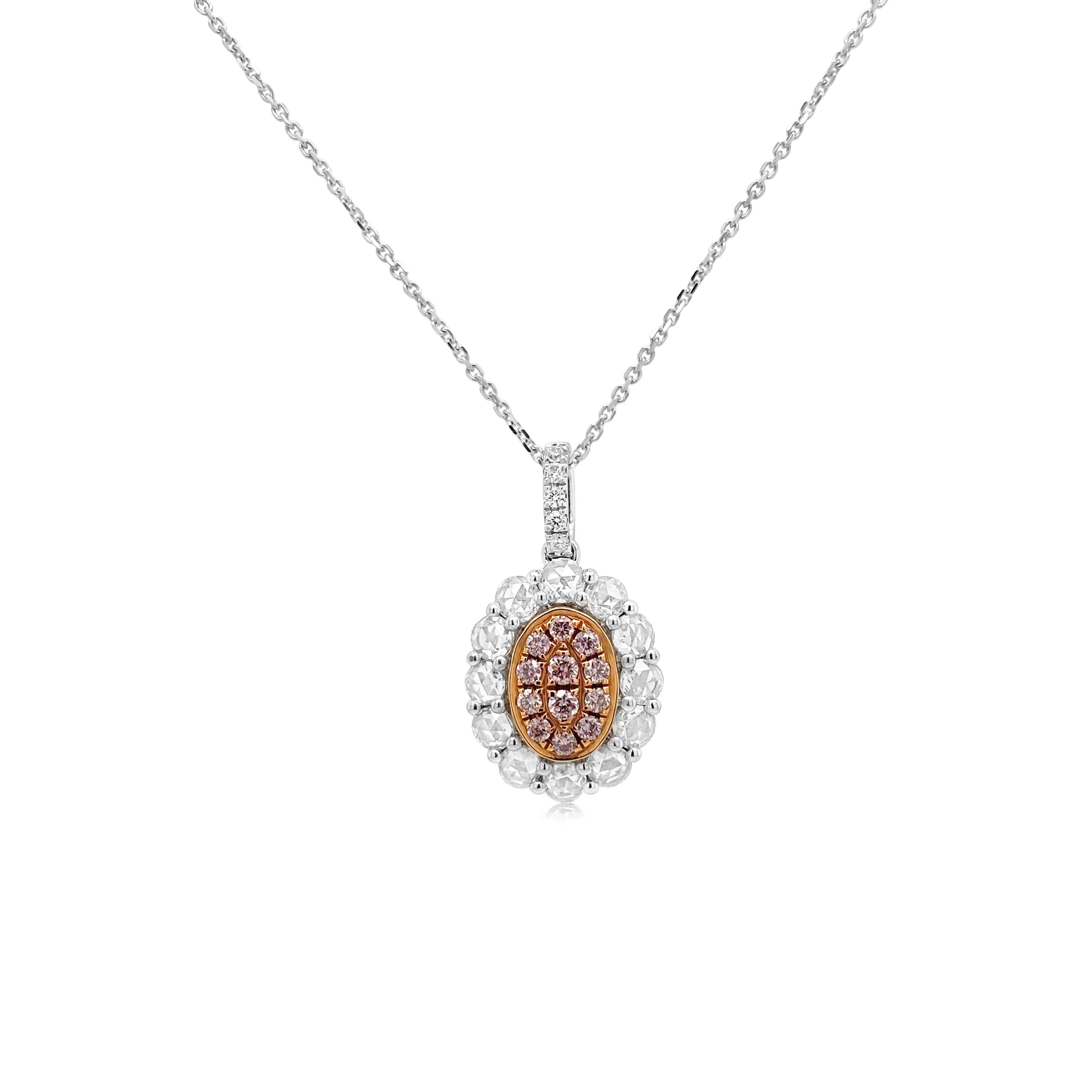 This oval shaped pendant showcases rare Argyle Pink diamonds arranged symmetrically , surrounded by petal like rose-cut diamonds giving the piece a vivacious and modern charm.
-	Round Brilliant Cut Argyle Pink Diamonds total 0.15 carat
-	Rose-Cut