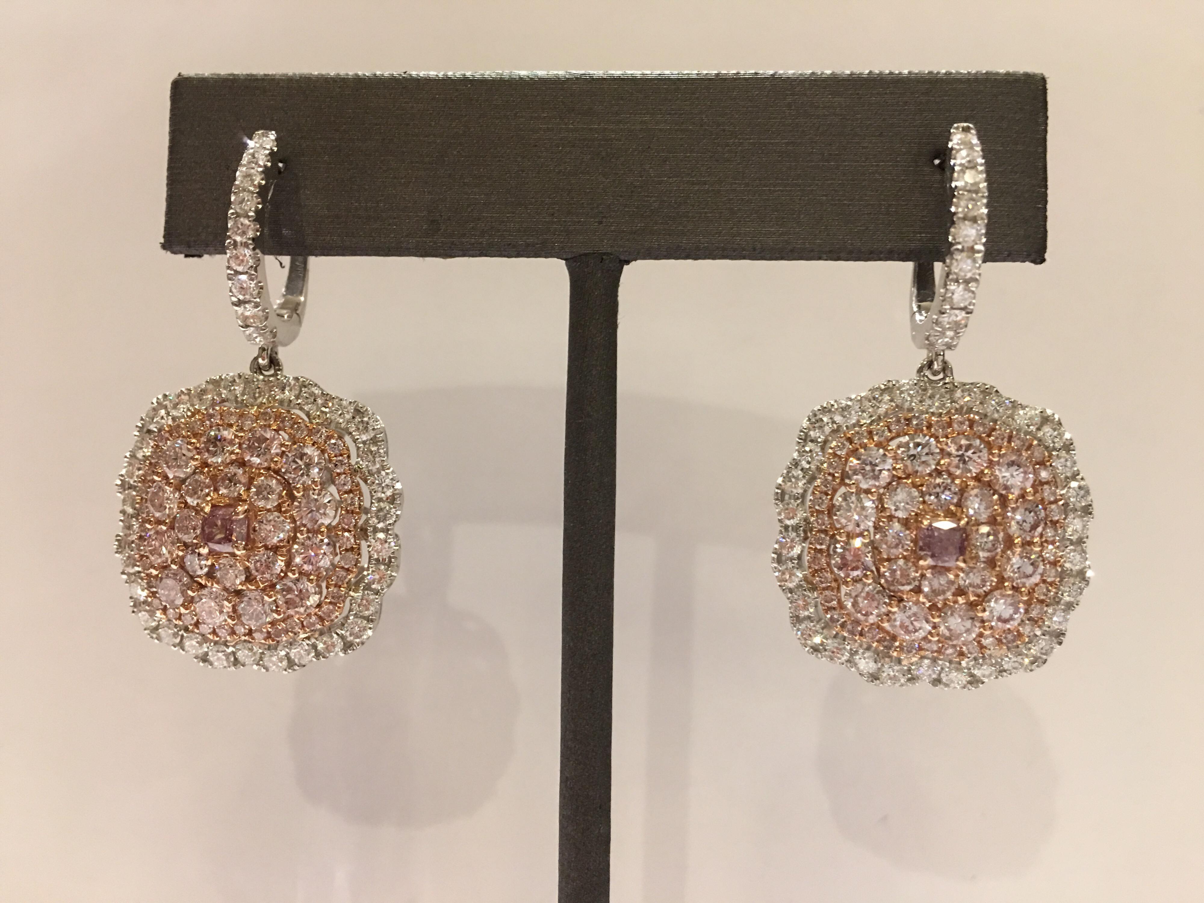 Natural Pink and White Diamonds set in 14K two tone Gold. Center two Pink is 0.39 Carat and other Pink are 3.55 Carat Diamond. Other white Diamonds are 1.93 Carat. 
One of kind hand crafted Earrings, Total Diamond Weight is 5.87 Carat VS Quality