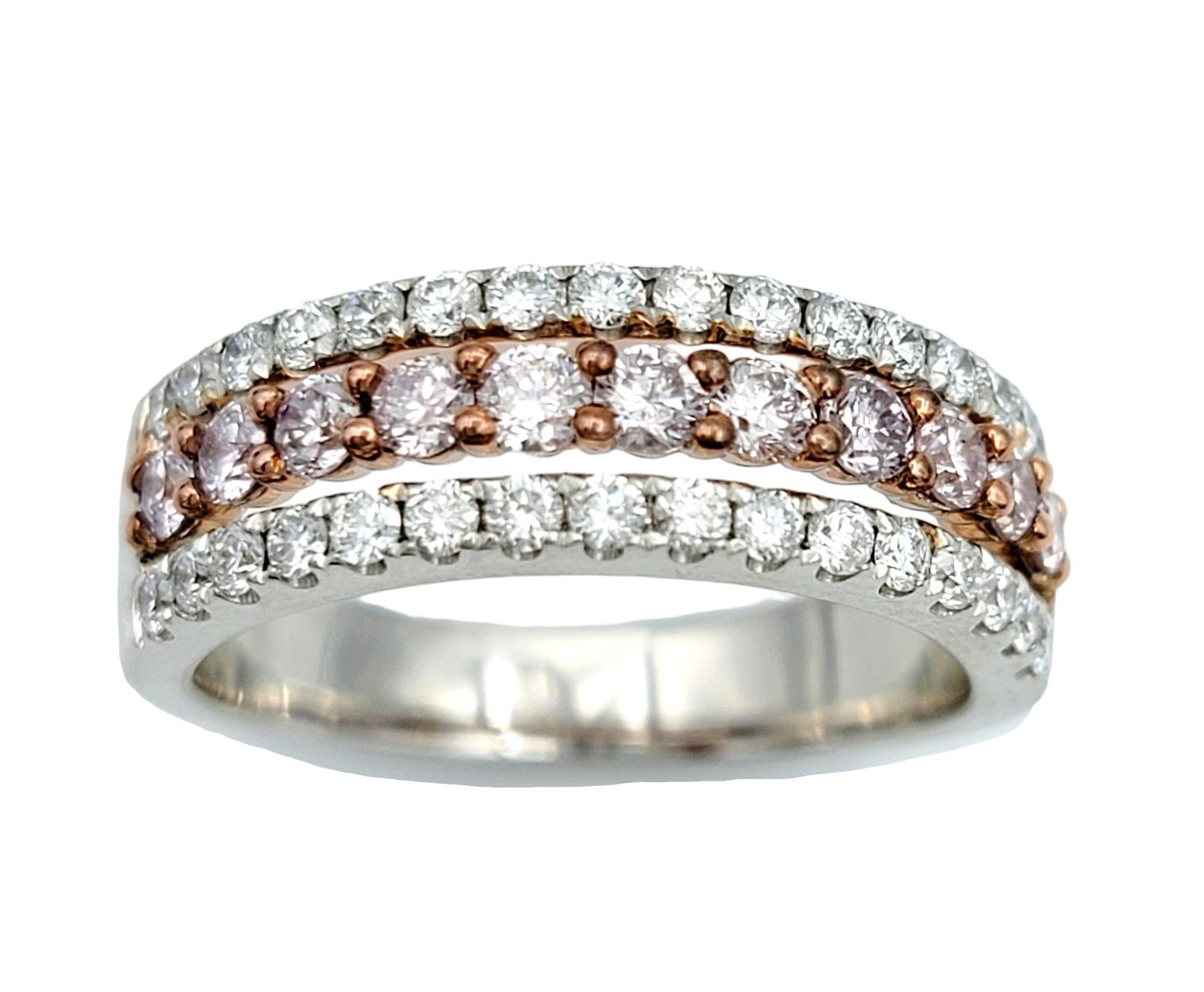 Ring size: 7

Introducing our enchanting multi-row pave diamond semi-eternity band ring, a captivating fusion of elegance and romance. Crafted in lustrous 18 karat white gold, this exquisite ring showcases three rows of meticulously set diamonds,