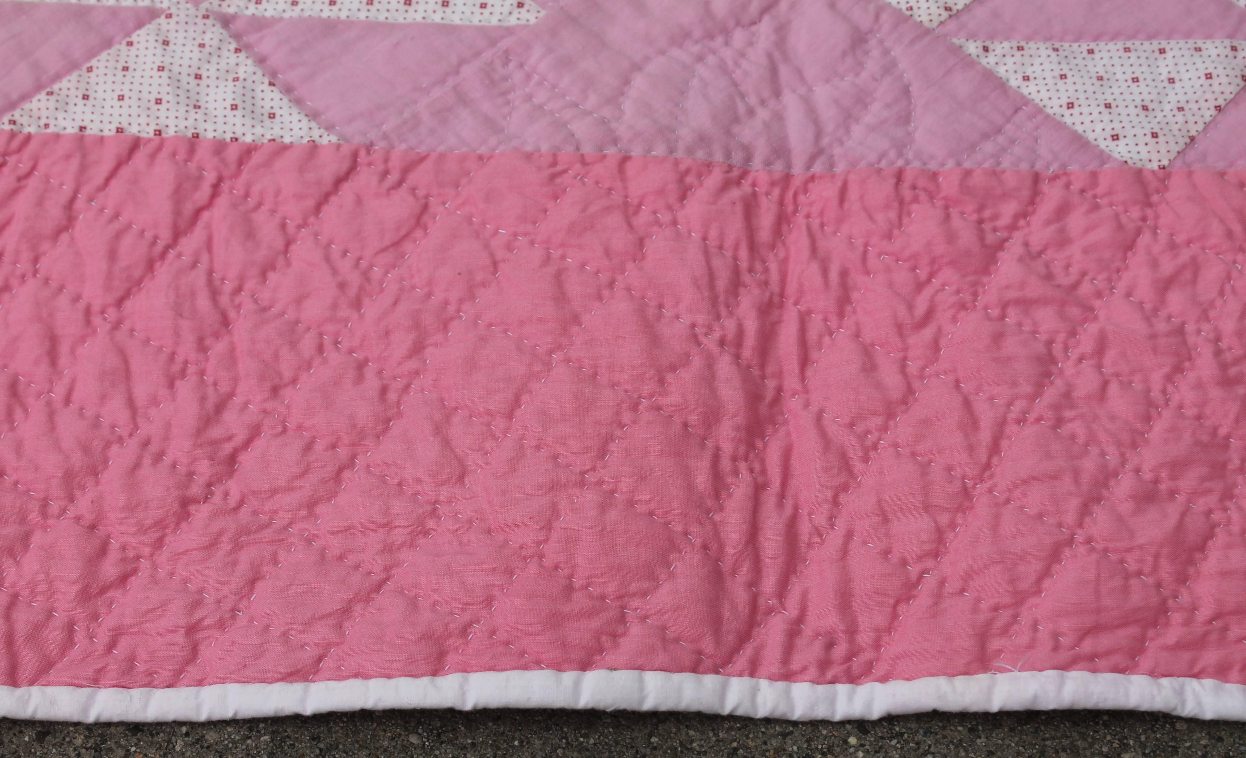 Hand-Crafted Pink and White Quilt in Contained Flying Geese Pattern