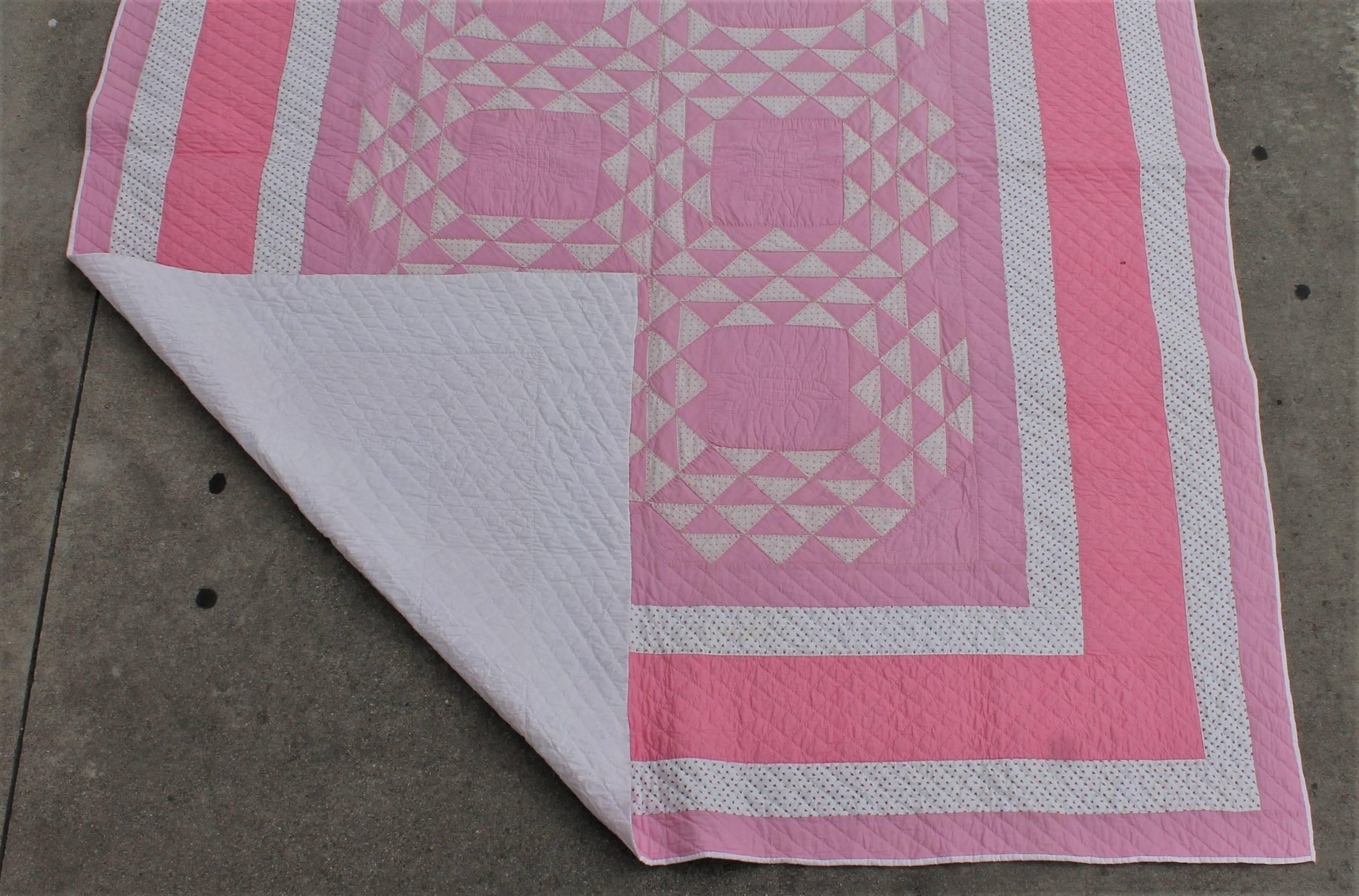 Mid-20th Century Pink and White Quilt in Contained Flying Geese Pattern